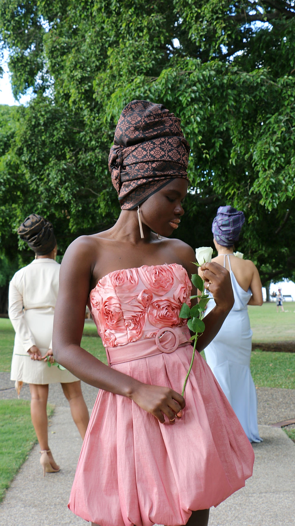 Bridesmaid or wedding guest? MARIAMA T strikes a pose in the foreground with brand ambassadors GRACEY B and DANIELA G in the background.
