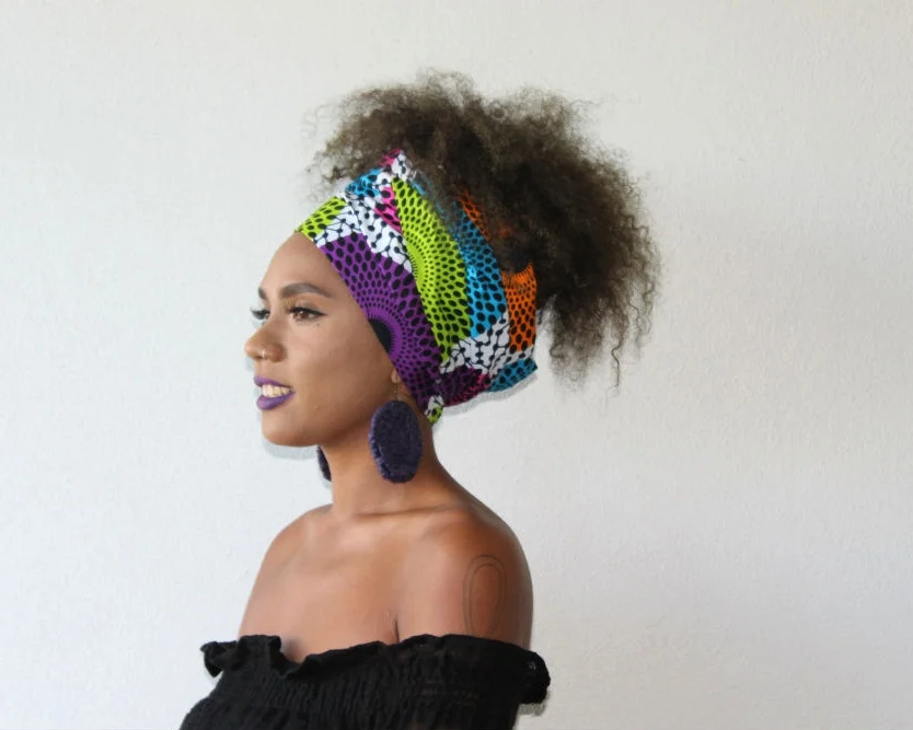 We teamed our ankara headwrap LERATO with a pair of raffia earrings from Yanbalala Arts. 