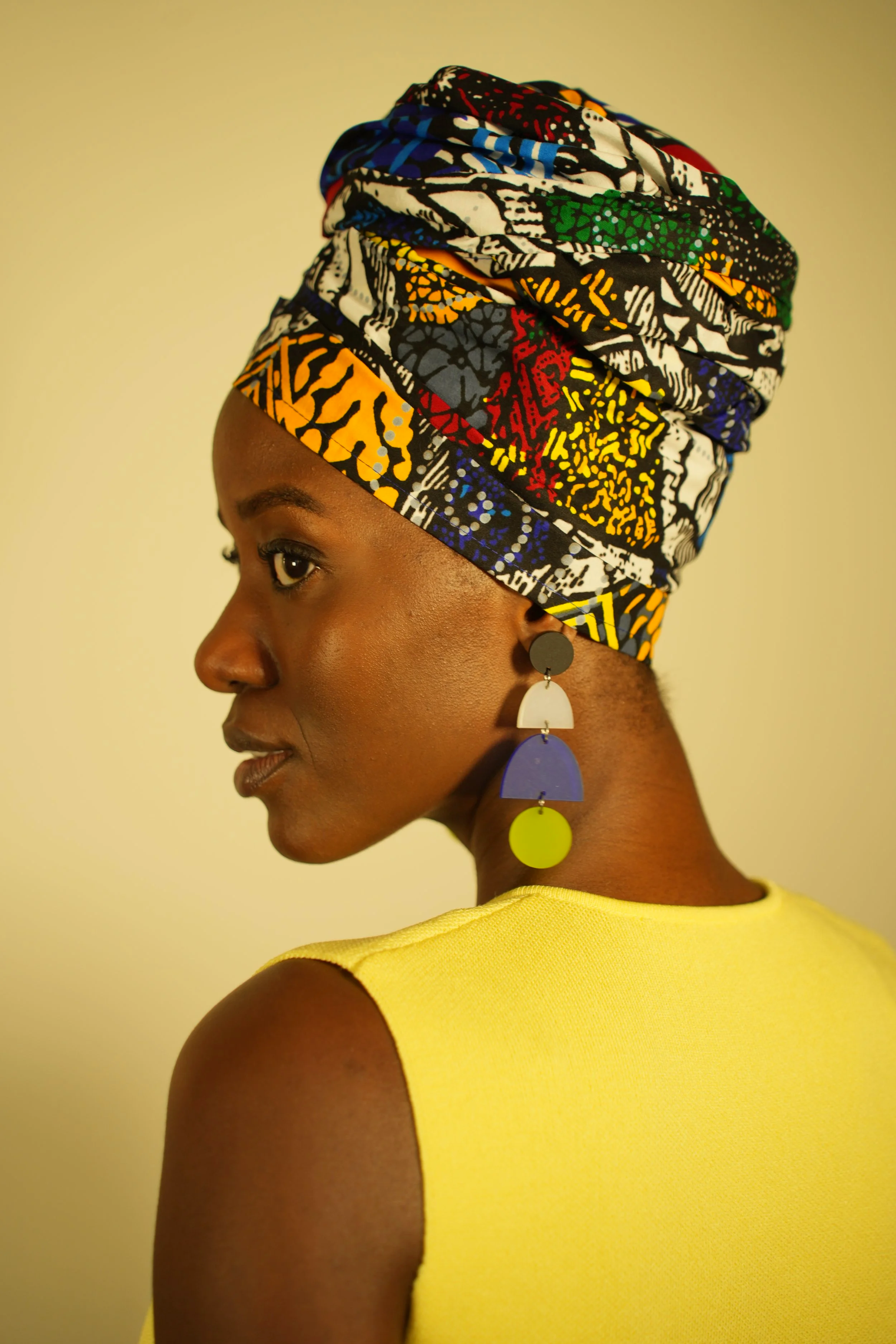 Woman looking sideways and wearing a headwrap