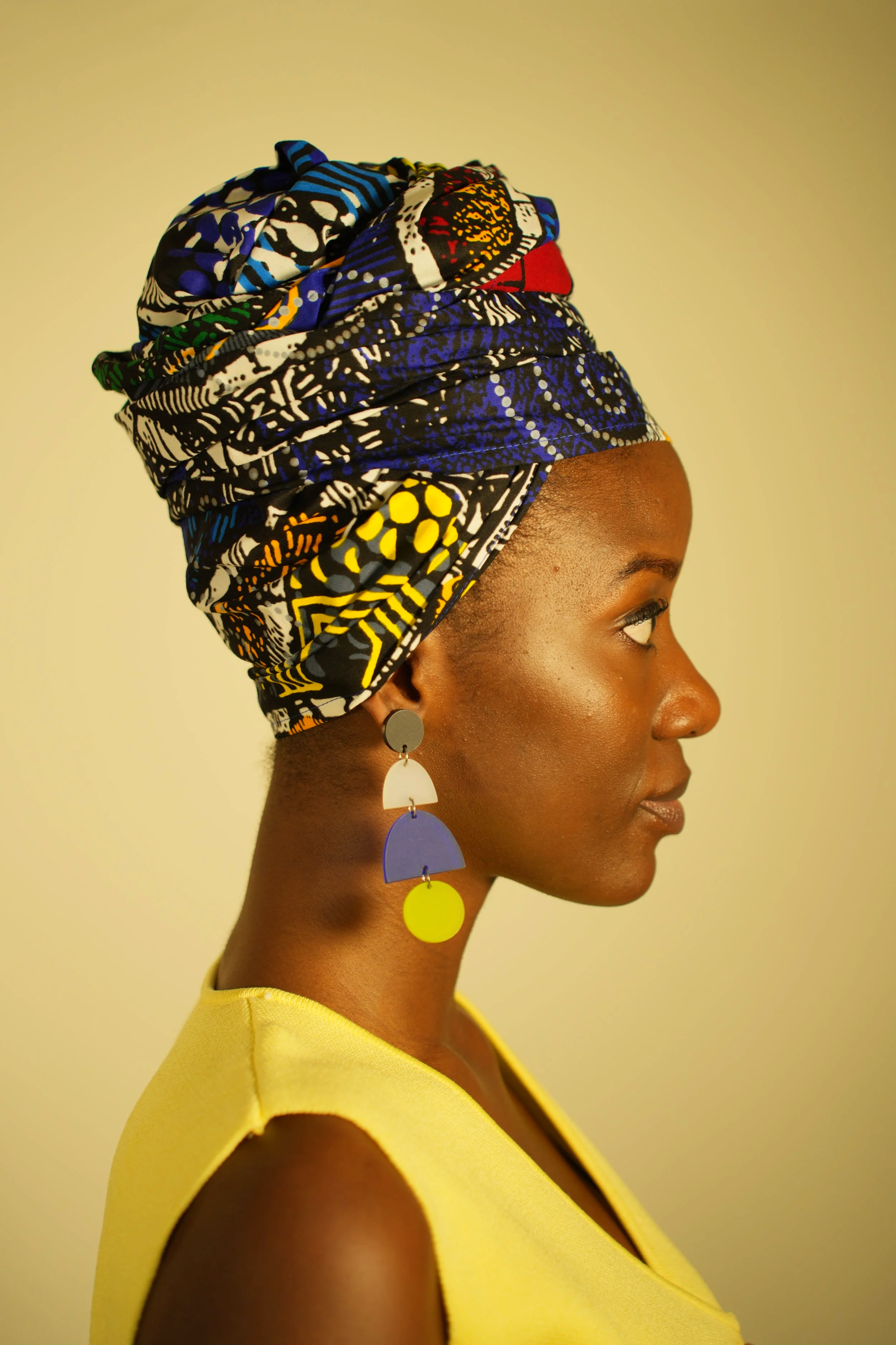 Woman looking sideways and wearing a headwrap