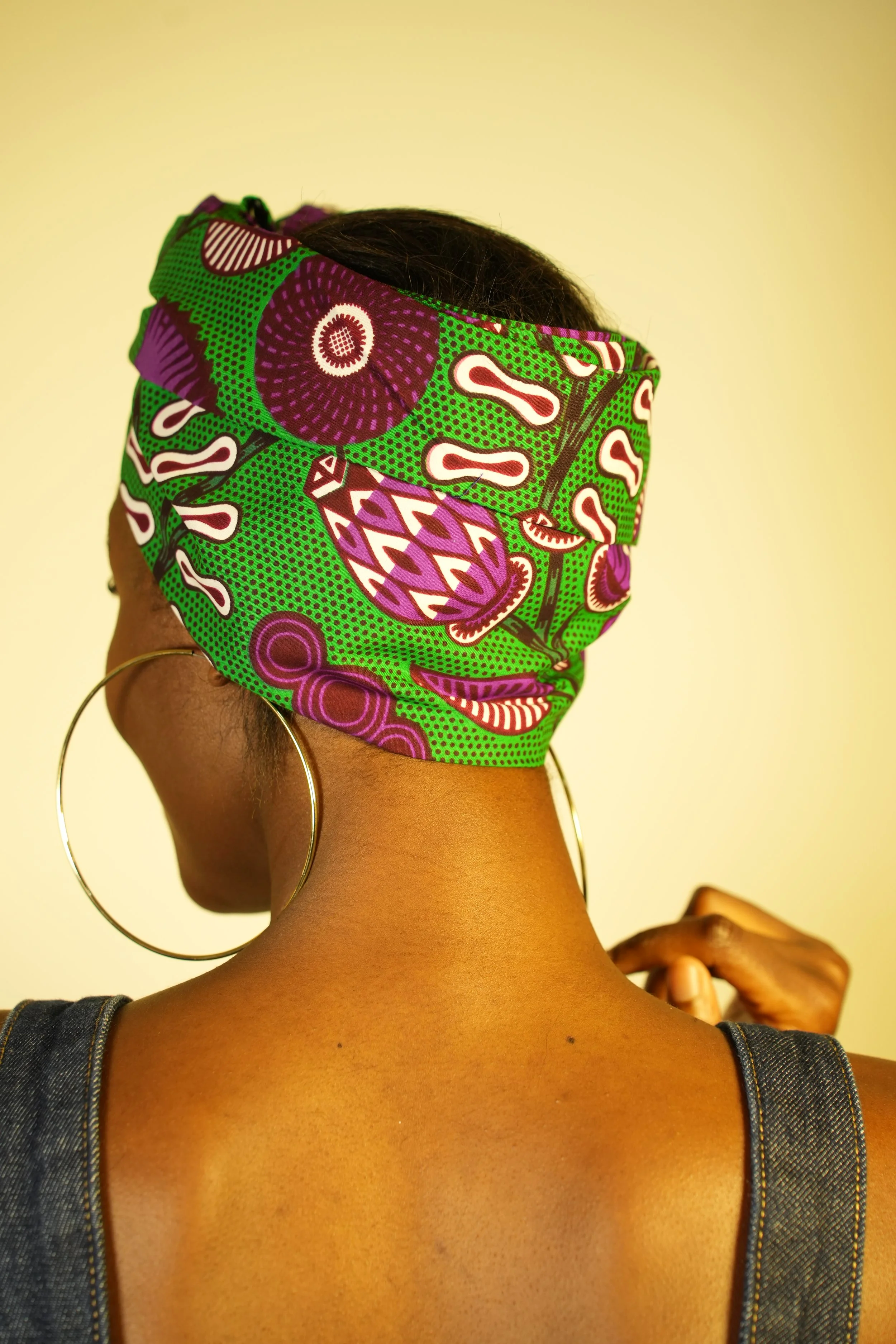 Back view of woman wearing a headwrap