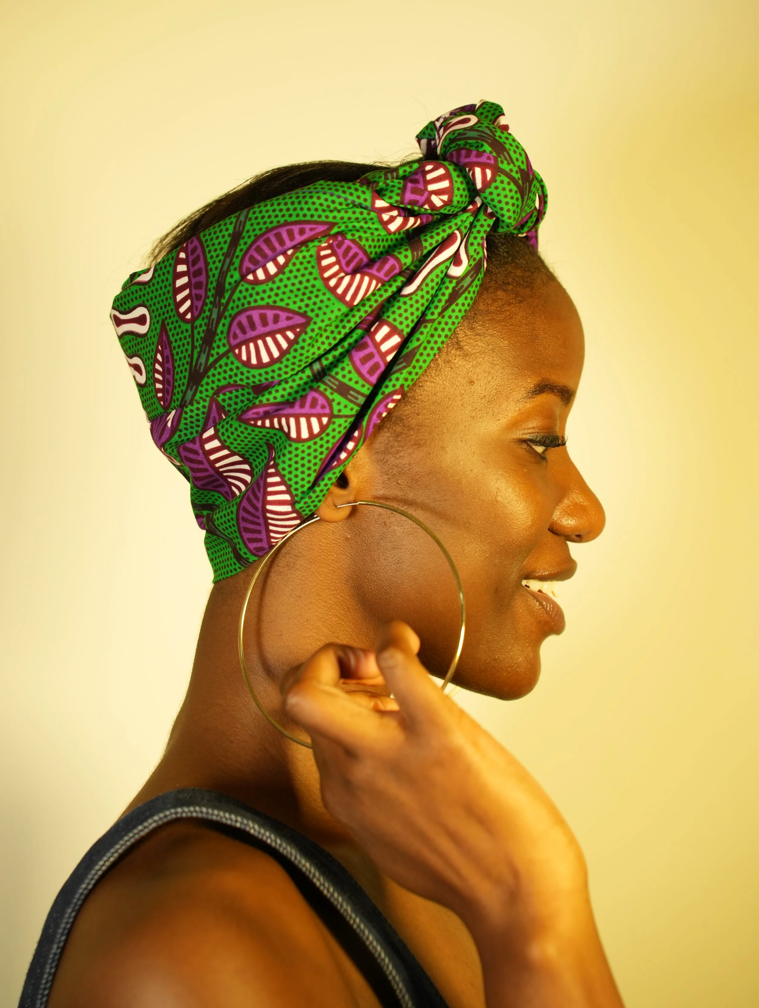 Side view of woman wearing a headwrap