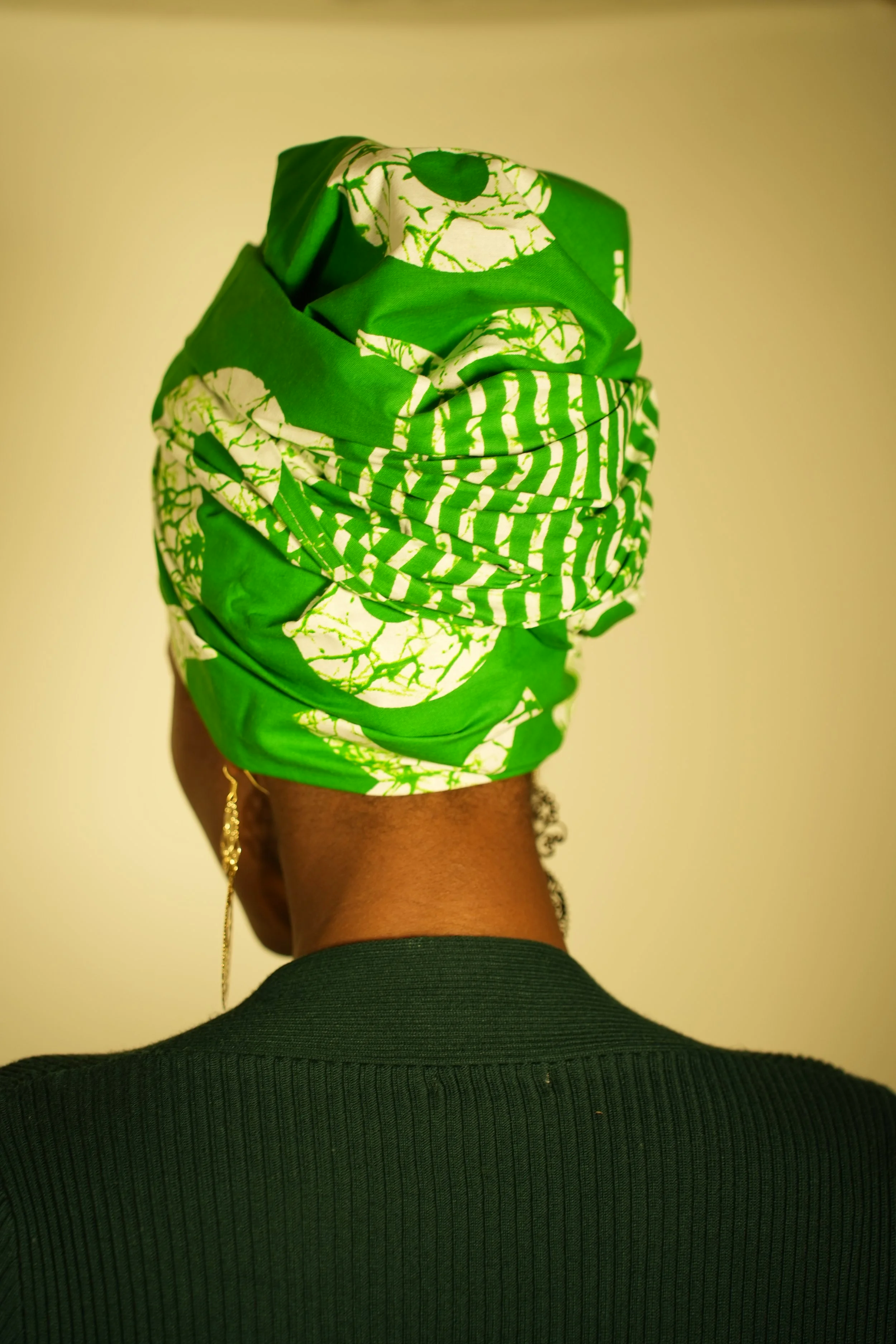 Back view of woman wearing a headwrap