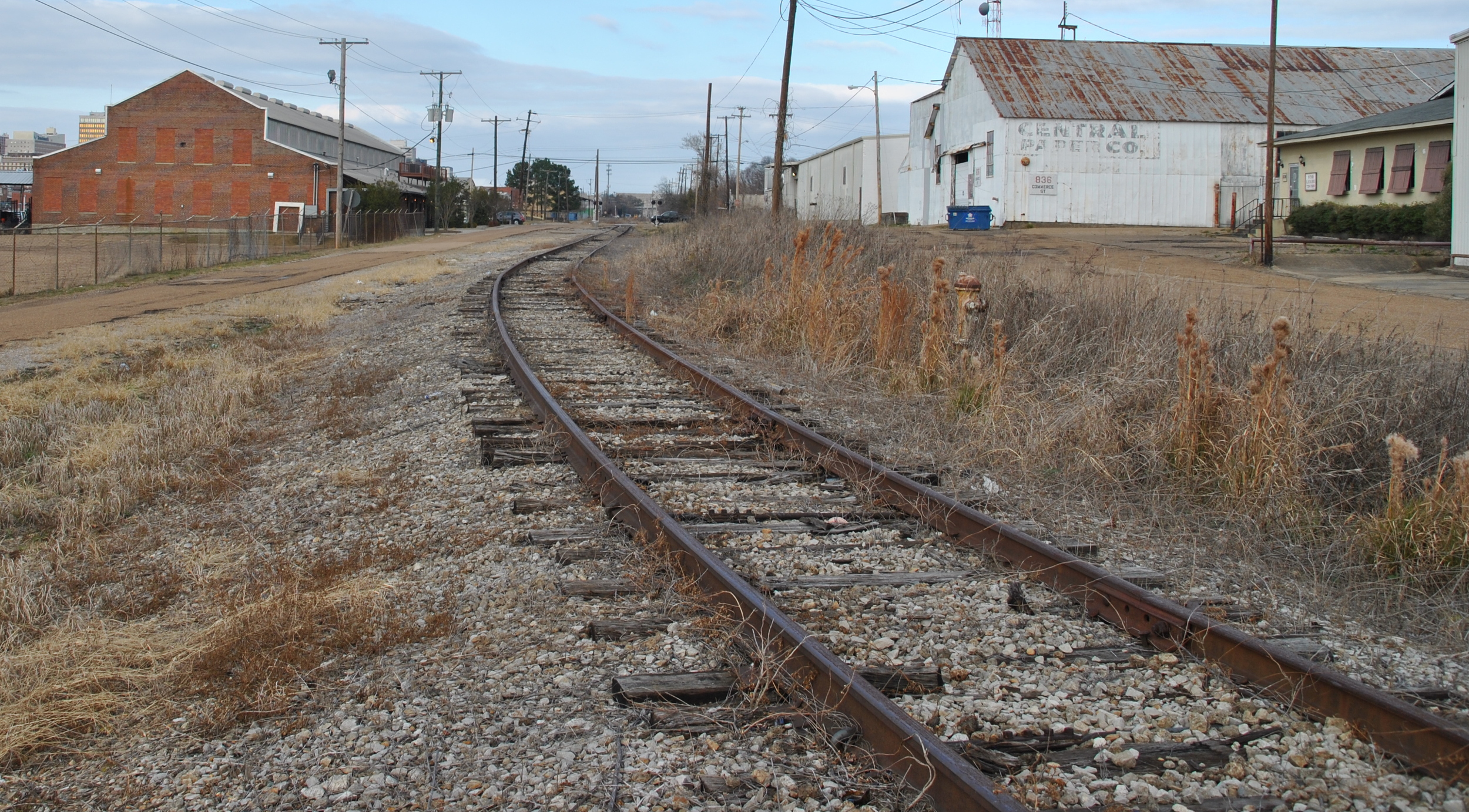 Old railroad buildings line the rails no one has pulled up for scrap. PROTIP: Steel sells!