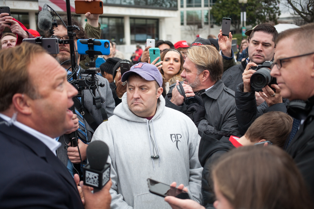 A Breitbart reporter, right, asking Jones a stupid question.