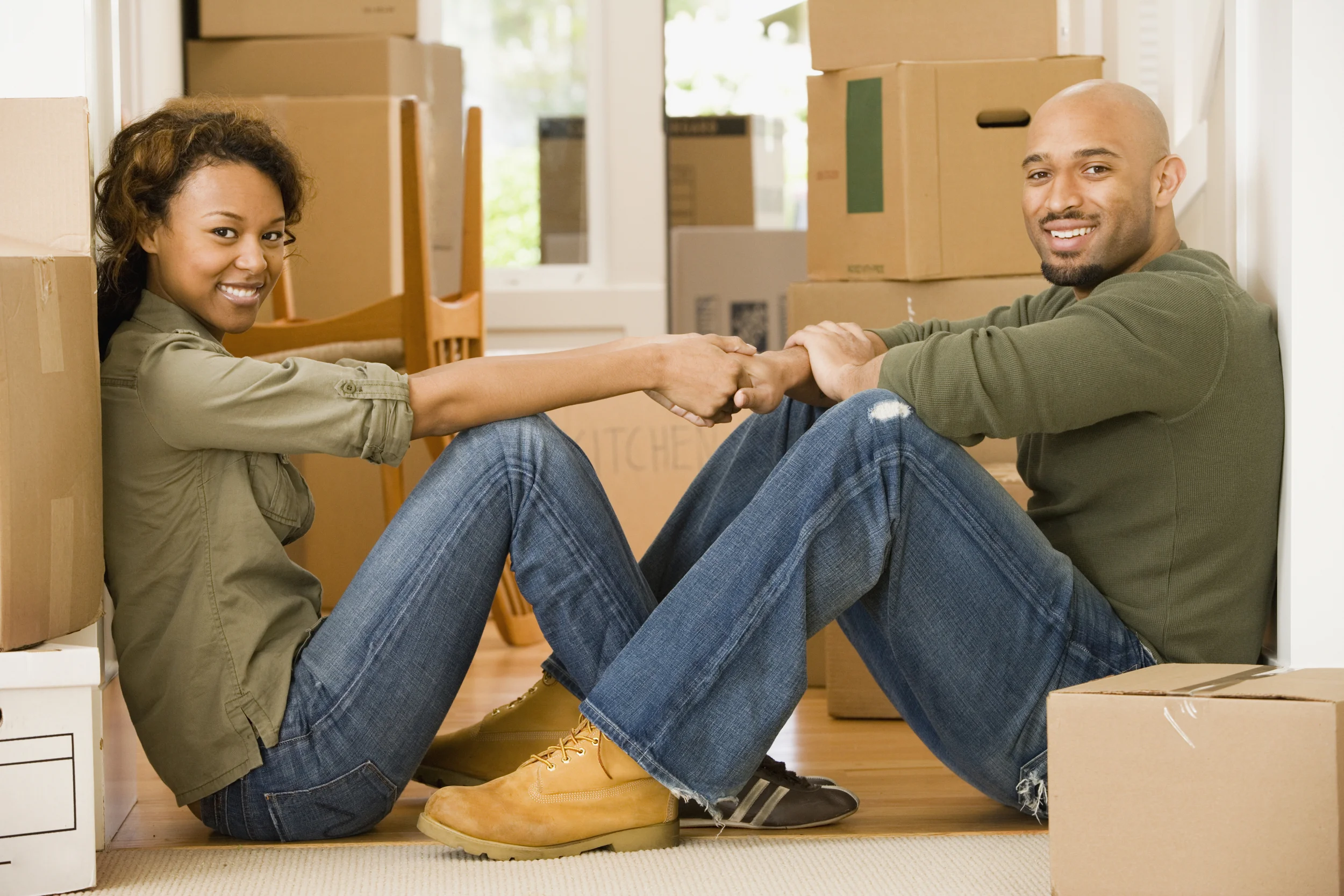 happy couple moving into new property