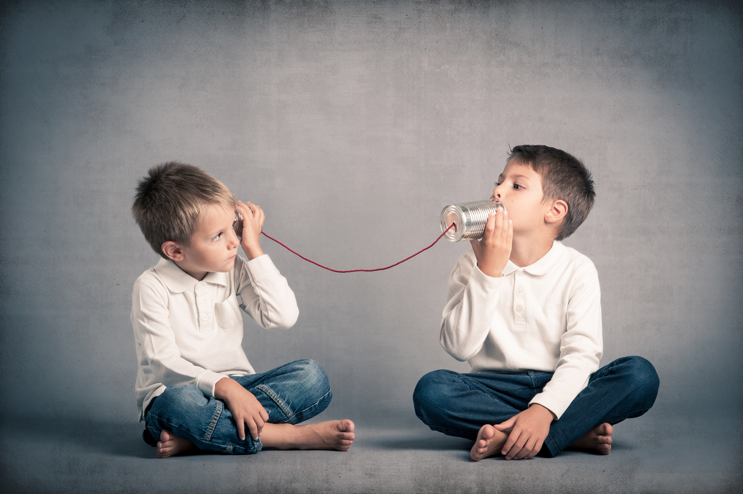 children with can and string phone