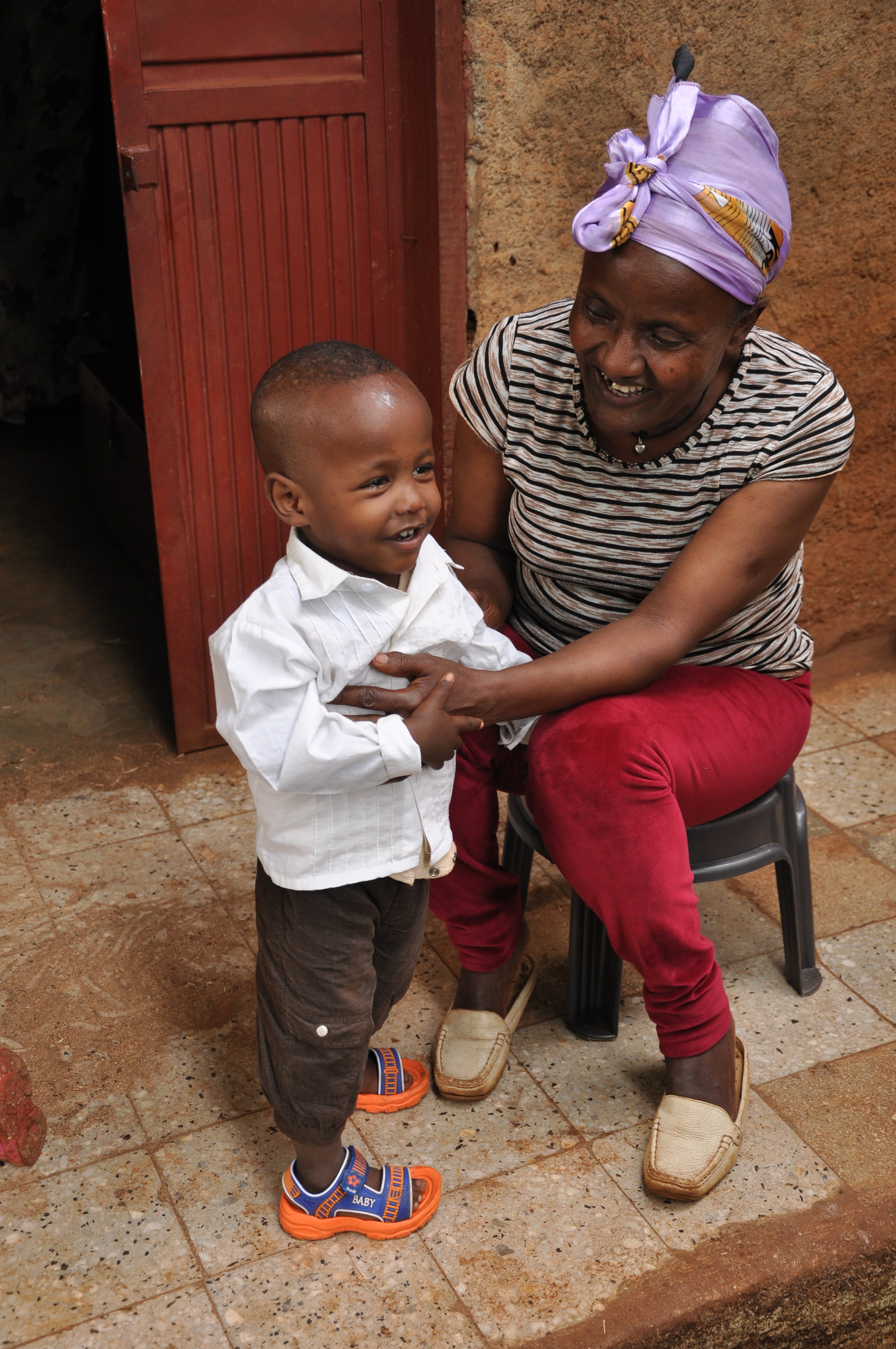  Yhune with his new mother, an older lady who just treats him like gold. 