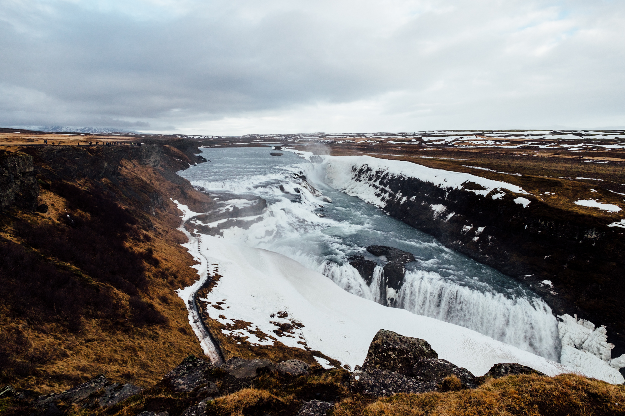  Our next stop was Gullfoss. Gullfoss is a huge waterfall (or convergence of a couple waterfalls, really) located in the canyon of Hvítá River. This is one of Iceland’s most popular landmarks, so it was crazy crowded. Still a great stop, although we 
