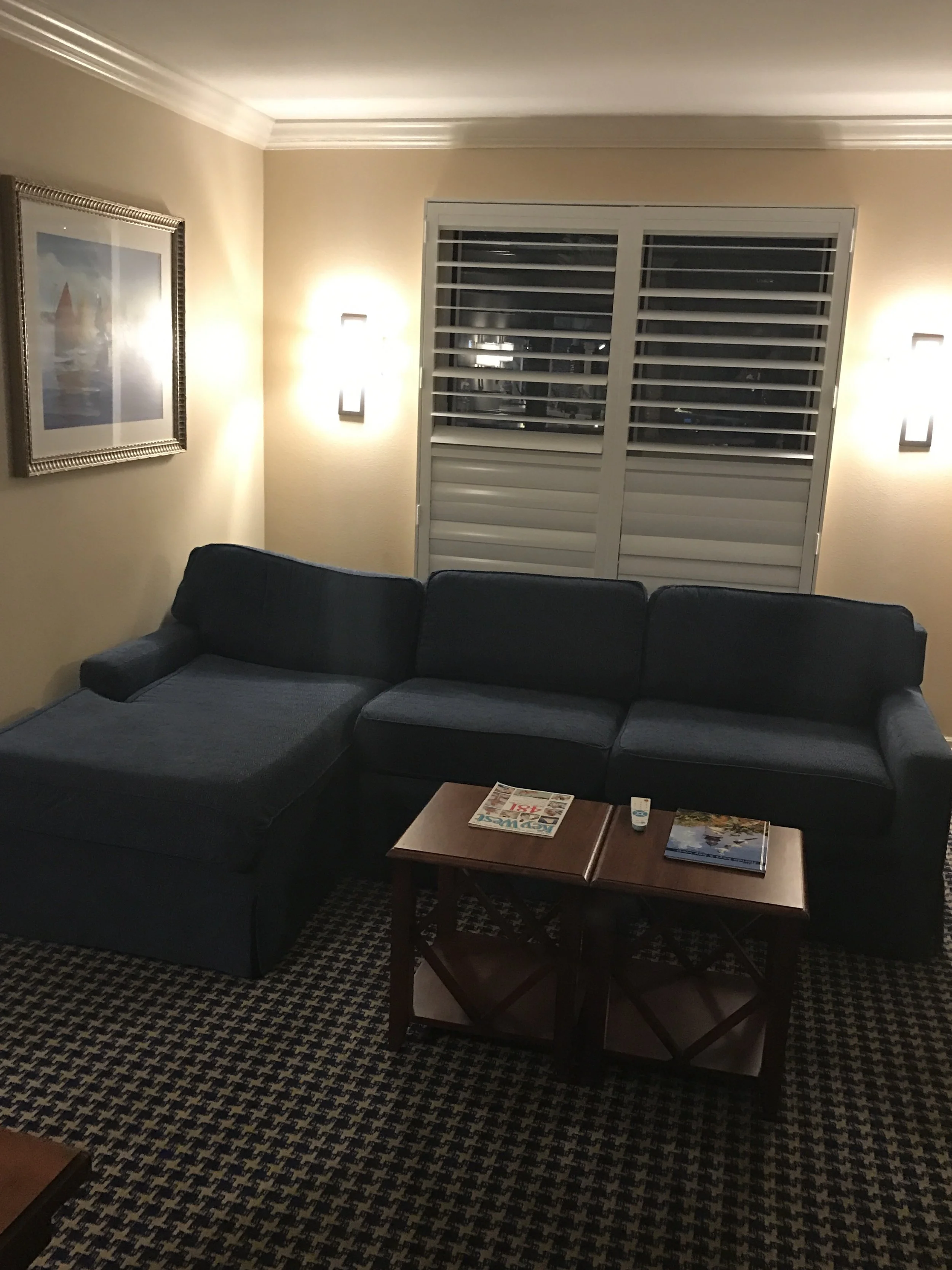 Living area with sofa and coffee table. The louvered shutters would be very necessary! (click to enlarge)