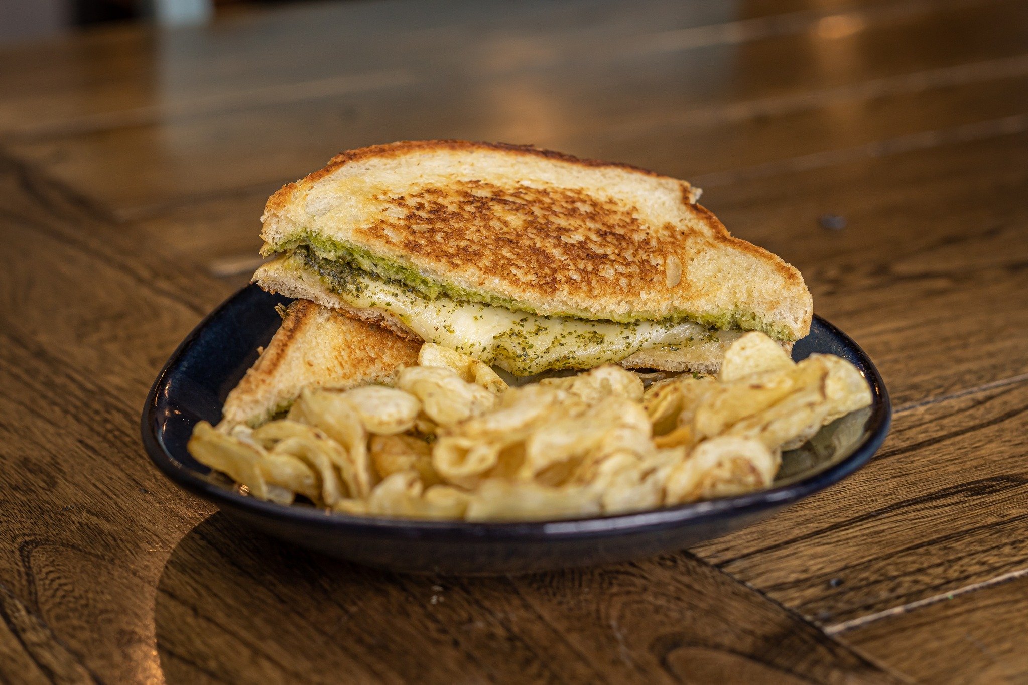 Sometimes you just want to stick to a classic when it comes time to eat. That's where our Pesto Grilled Cheese comes in!

This sandwich is a customer favorite. We take harvarti cheese and a pesto spread, bring them together between two pieces of sour