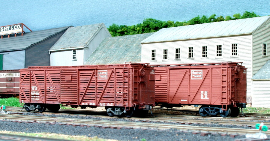 In 1945, the B&M converted 15 of its single sheathed boxcars into stock cars. Standing behind 27510 is one of the type of cars converted by removing side boards. Both built by Edward J. Ozog from F&C Kits. Photographed and submitted by Mr. Ozog. Photo 793