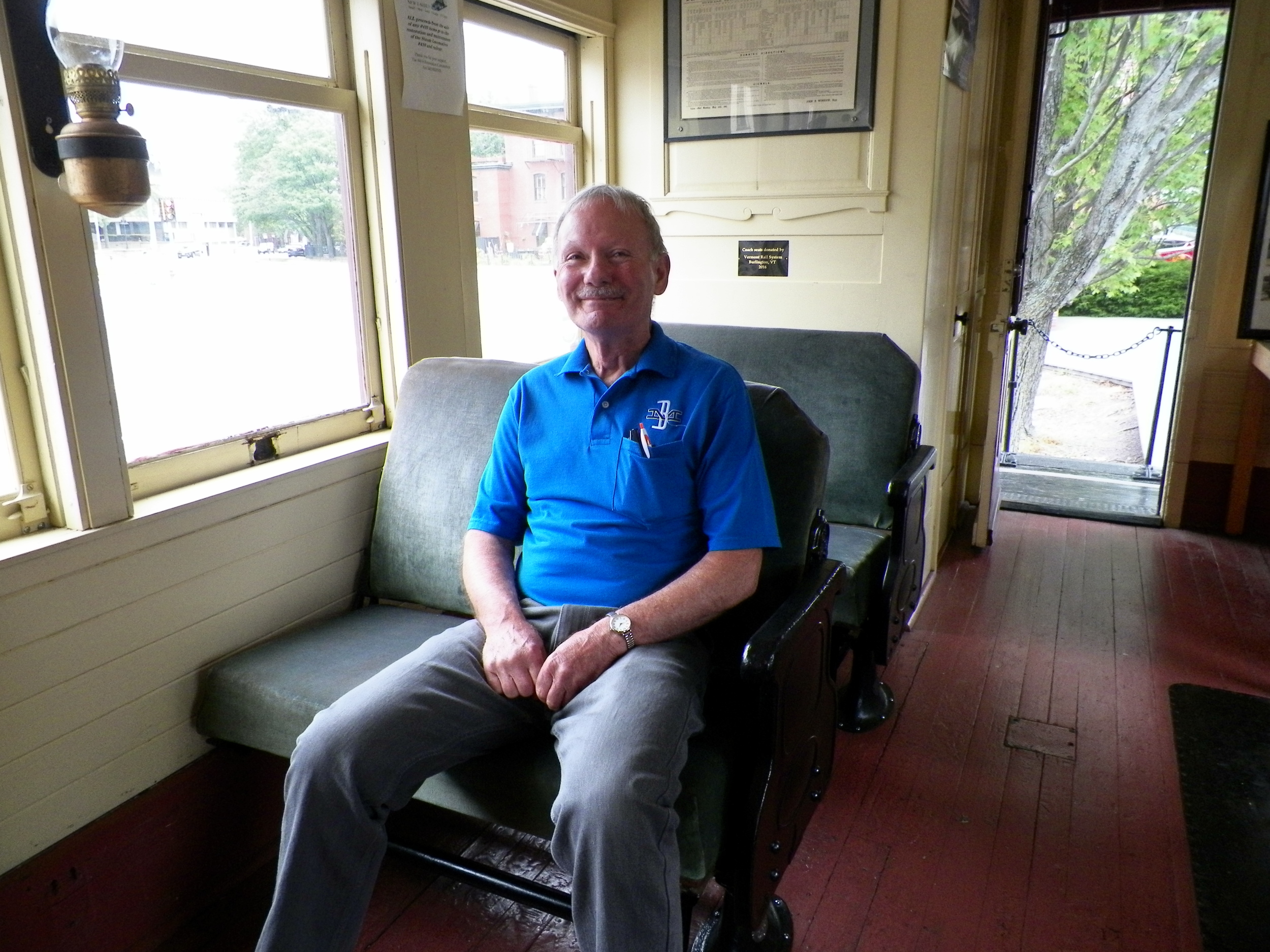 B&MRRHS volunteer Mal Sockol tries out new coach seats recently donated to B&MRRHS by Vermont Rail System. Richard Nichols photo