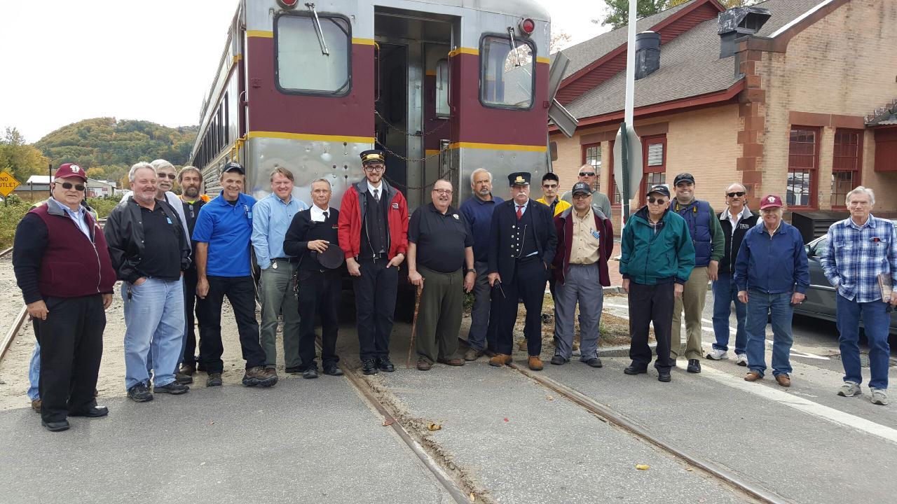 Crowd of B&MRRHS members assembles to meet and greet the crew Winnipesaukee Scenic Railroad autumn foliage excursion train at Plymouth, N.H. , October 15, 2016. Chuck Spence photo.