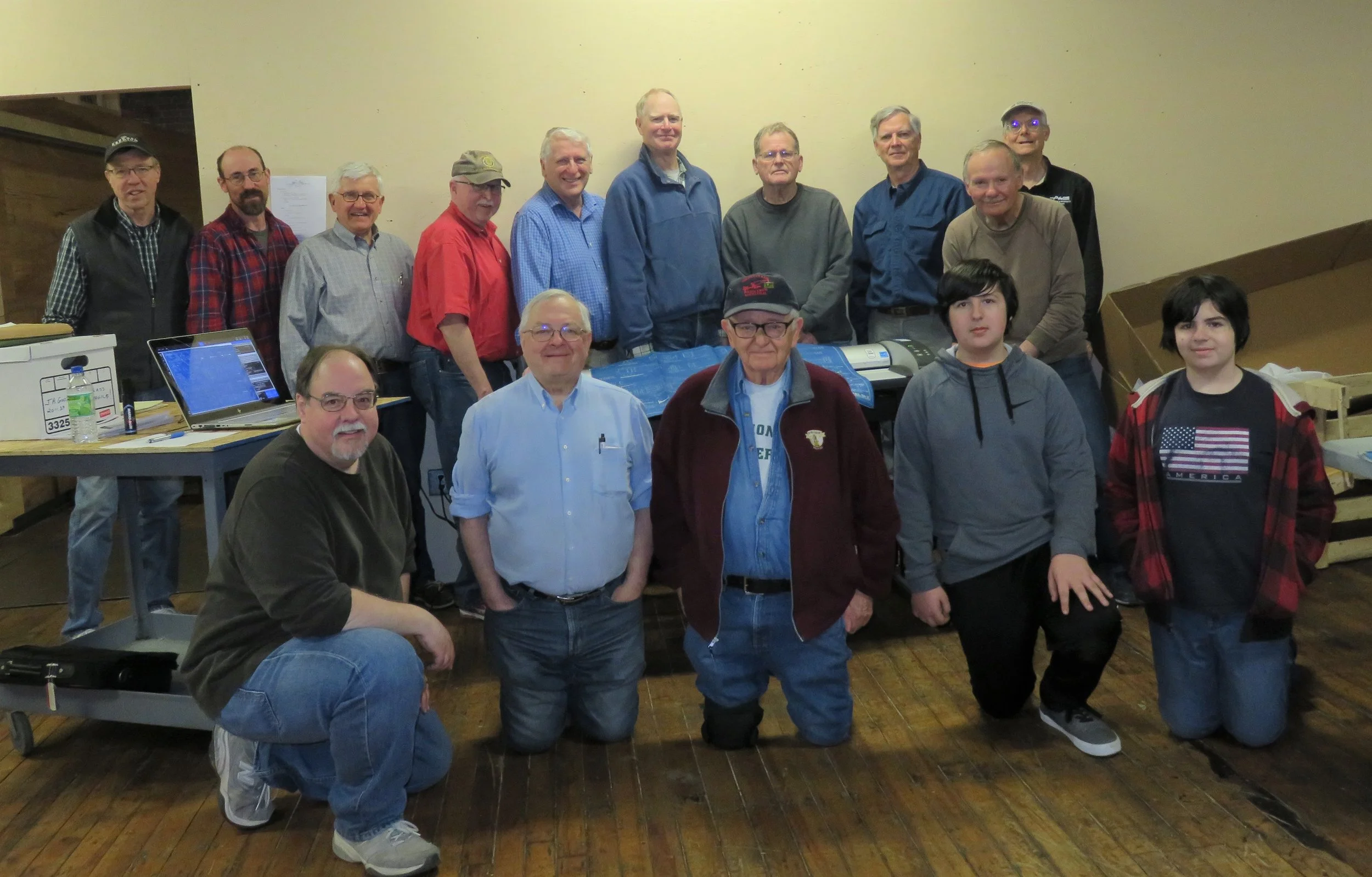 Archives Committee members pause for group shot during work session at North Chelmsford on March 31, 2018. Front row left to right Alan lePain, Rick Hurst, Society President Dan Hyde, Matthew LePain, and Caleb LePain. Back row Jimi Smith, Earl Tuson, Rick Nowell, Jack Madden, Carl Byron, Brad Blodget, Bob Farrenkopf, Coley Walsh, Mal Sockol, and Rick Conard. Alan LePain photo. 