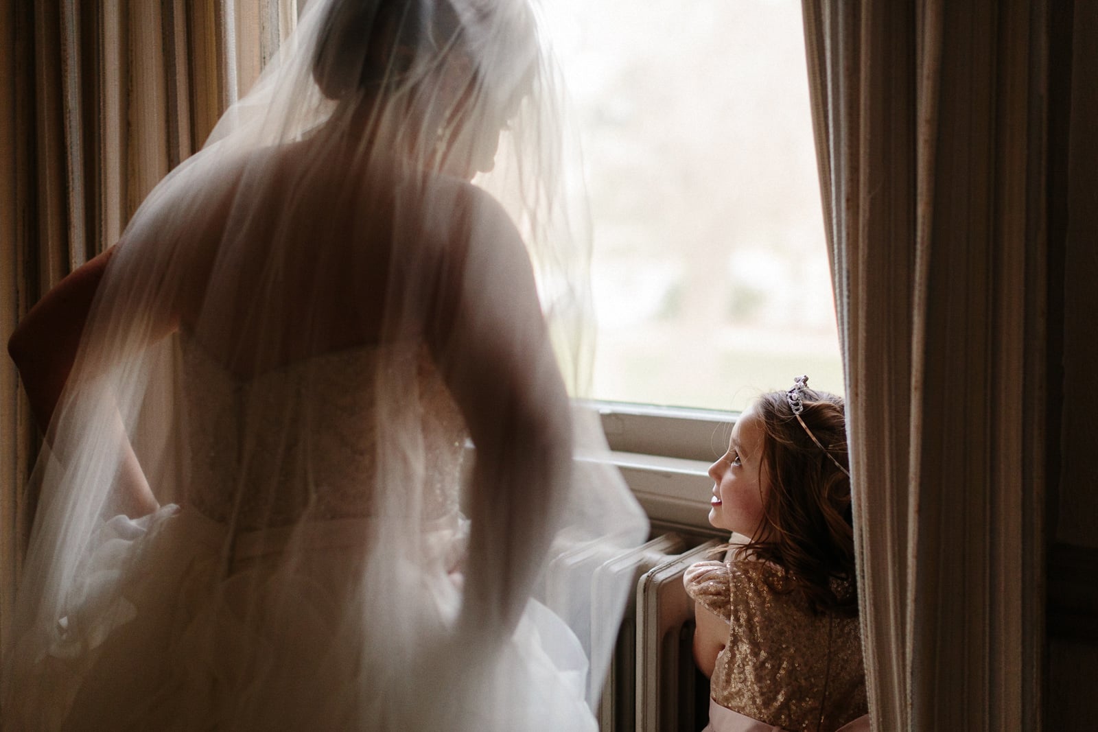 015-bride-and-flower-girl-at-window.jpg