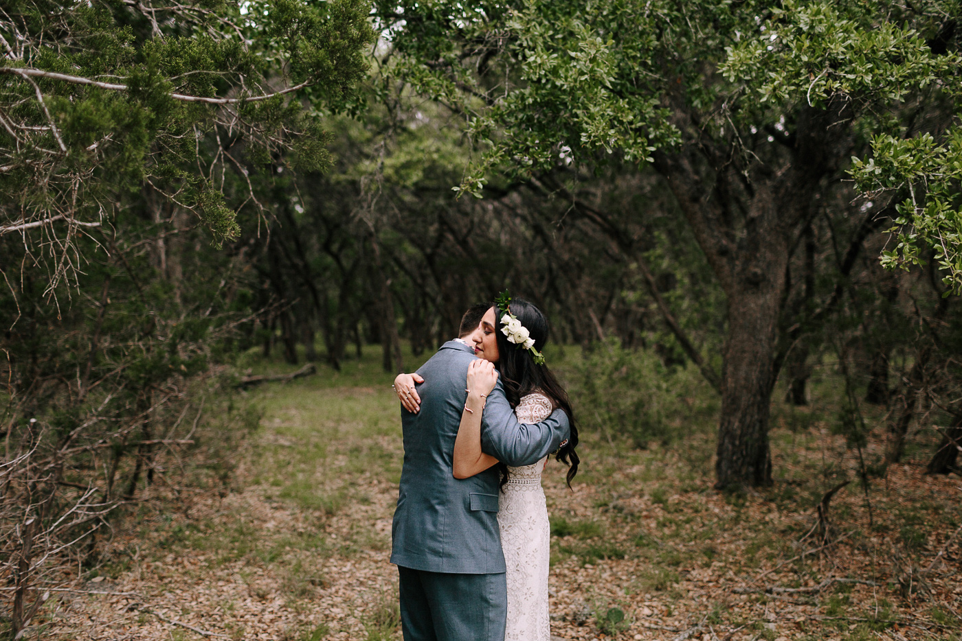 Blue Hole Regional Park Bride and Groom Embracing in Forest