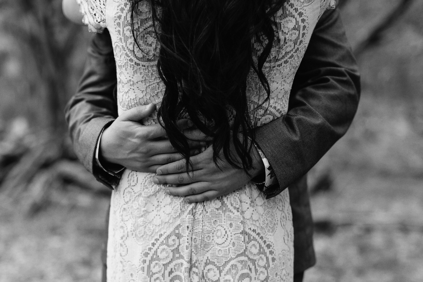 Groom's Hands on Bride's Waist Black and White Portrait