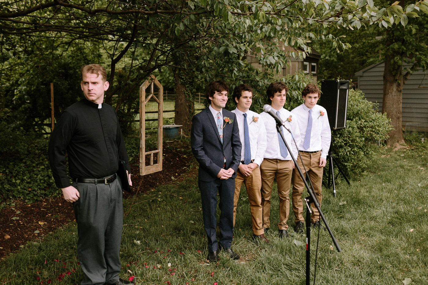 Groom and groomsmen ceremony waiting for bride