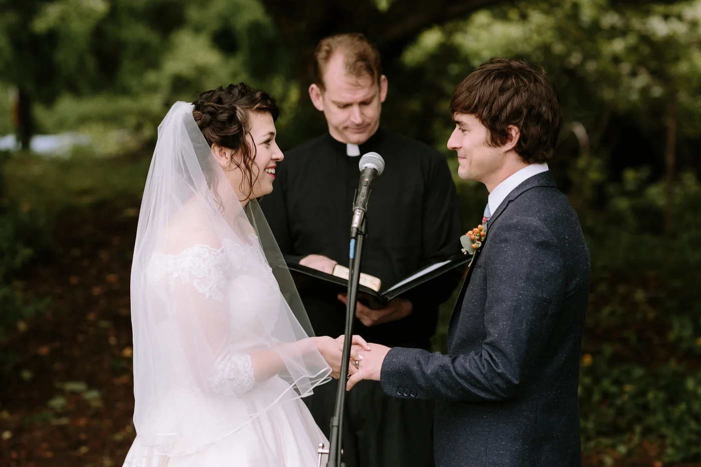Bride and groom smiling at each other