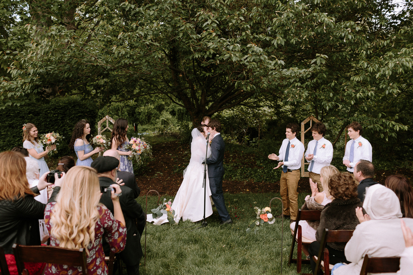 First kiss backyard wedding