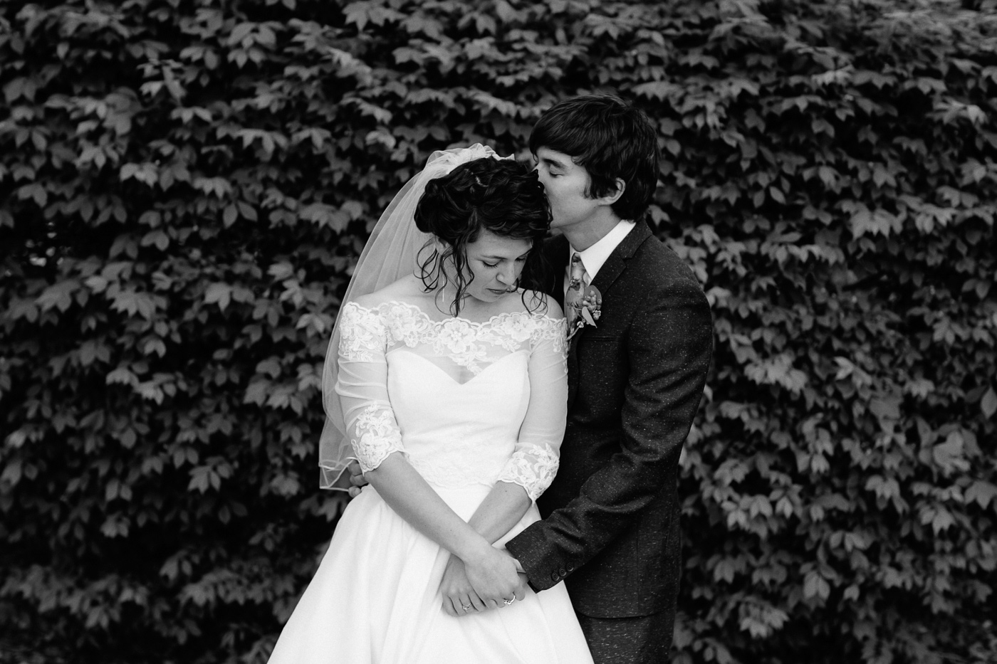 Bride and groom black and white with leaves