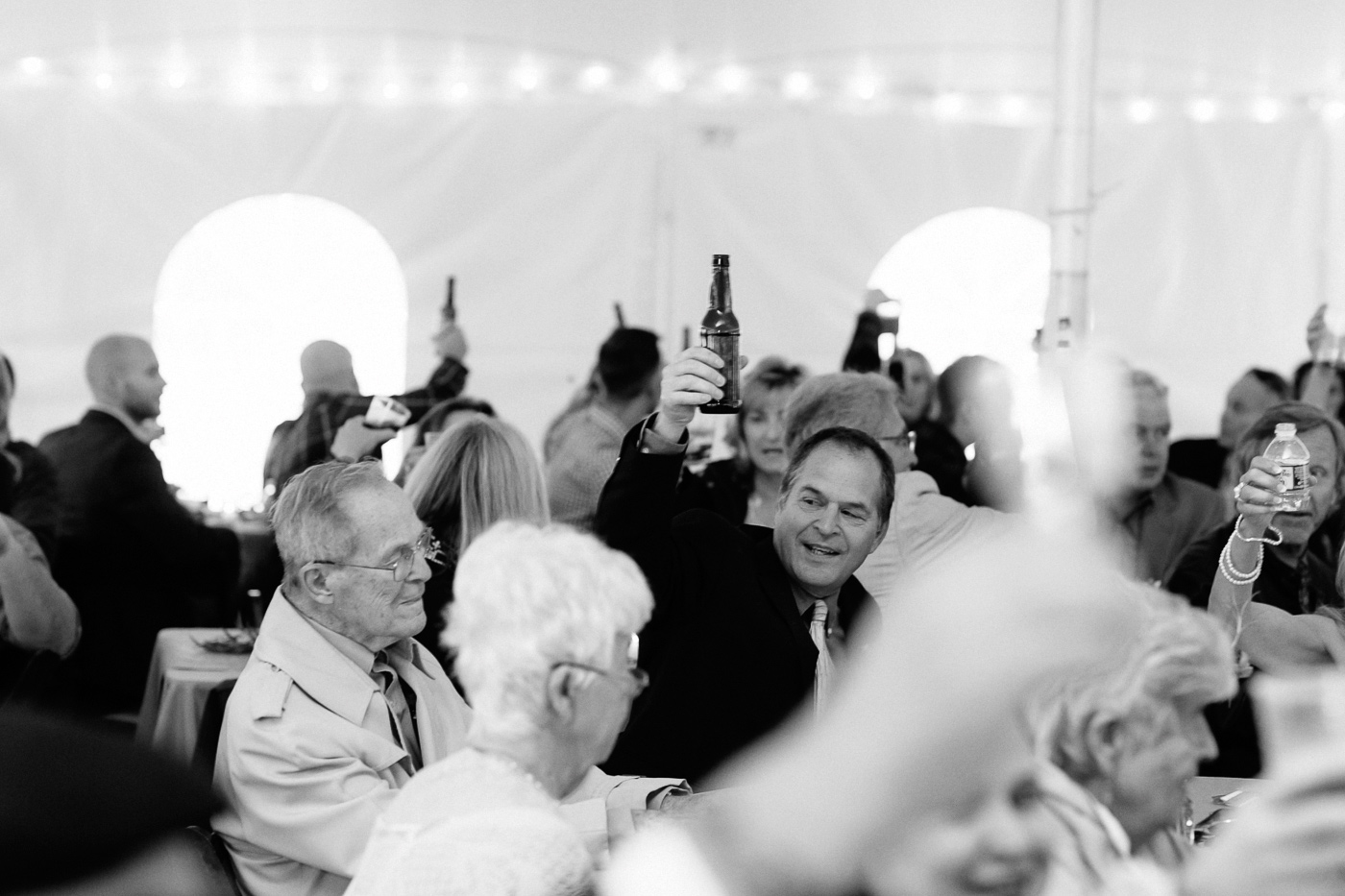 Father of the groom raising a glass