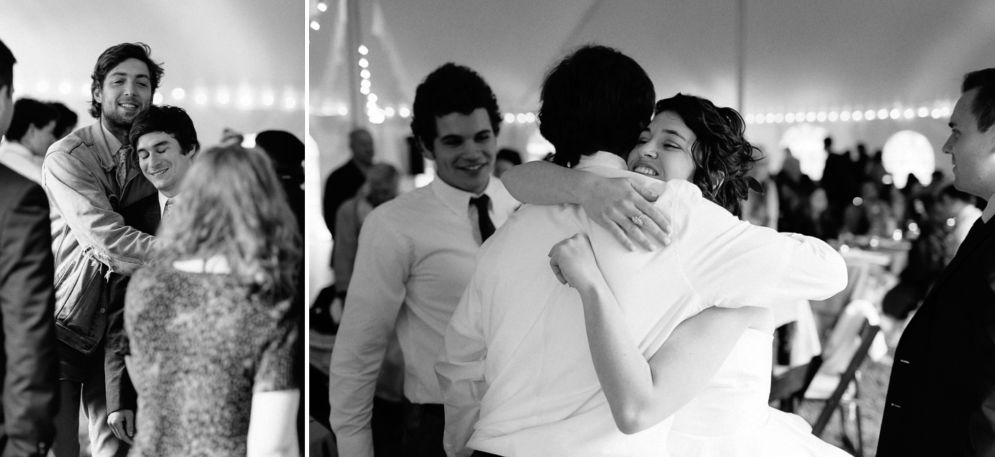 Bride and groom hugging friends