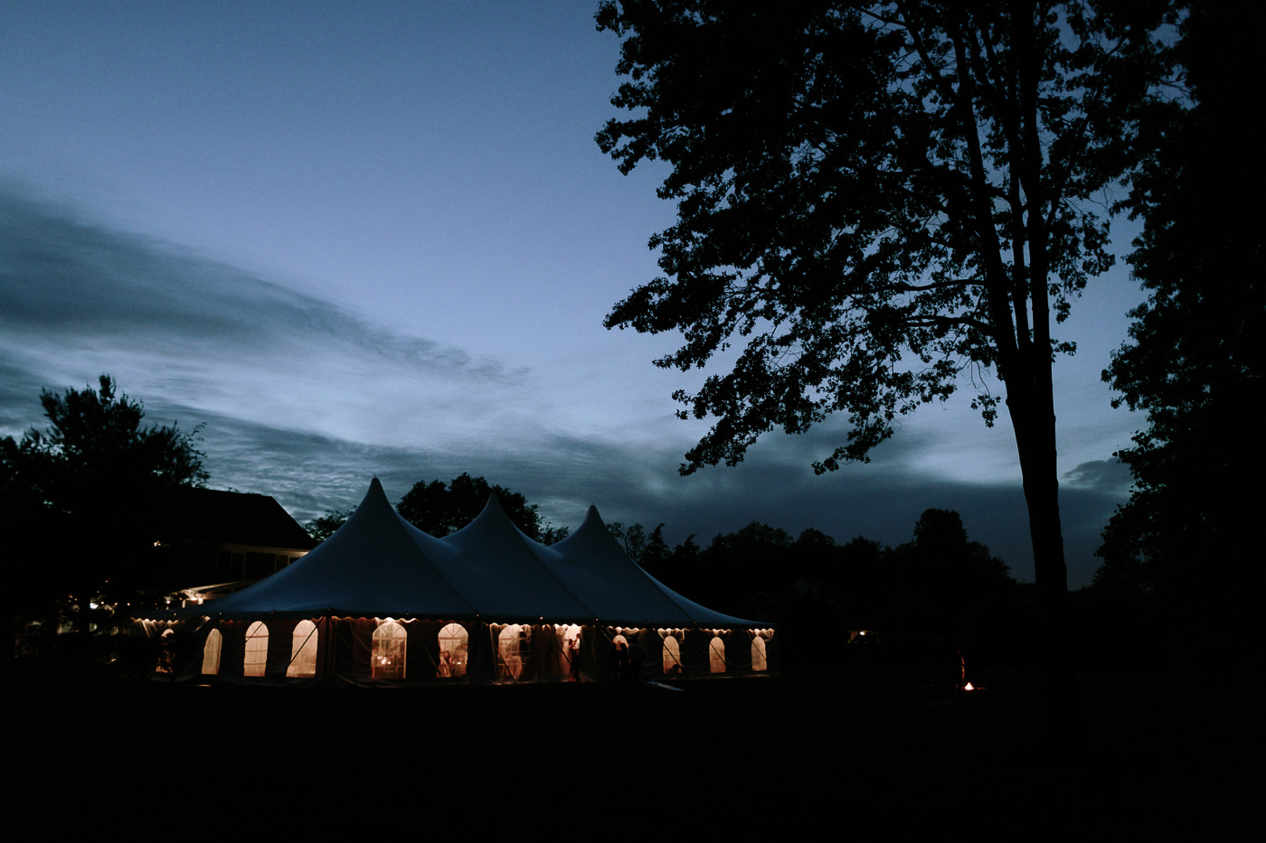 Backyard wedding reception at dusk