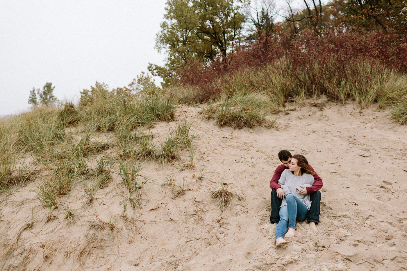 Couple sitting in the sand