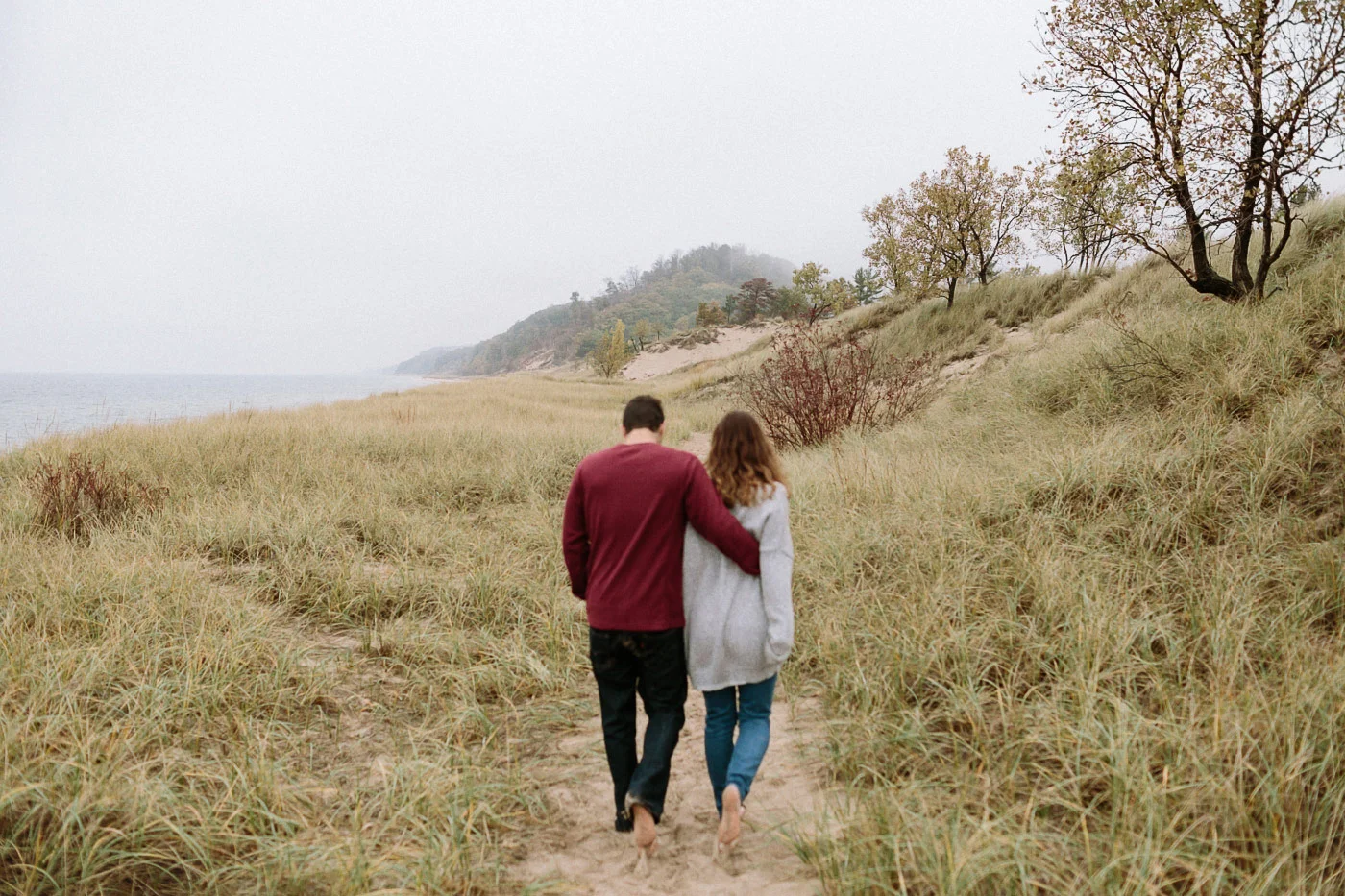 Couple walking along beach path