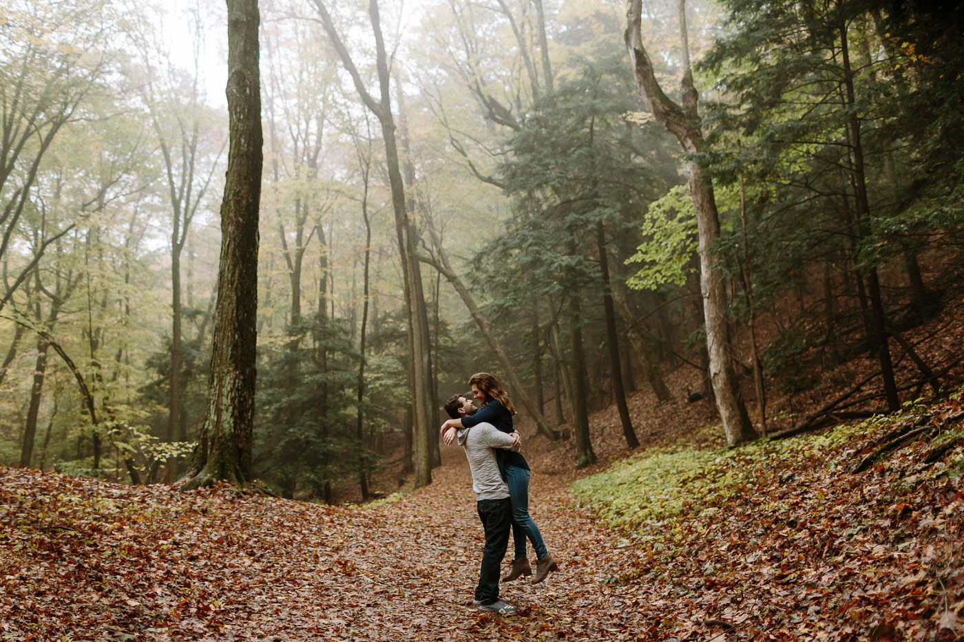 Couple embracing in foggy forest
