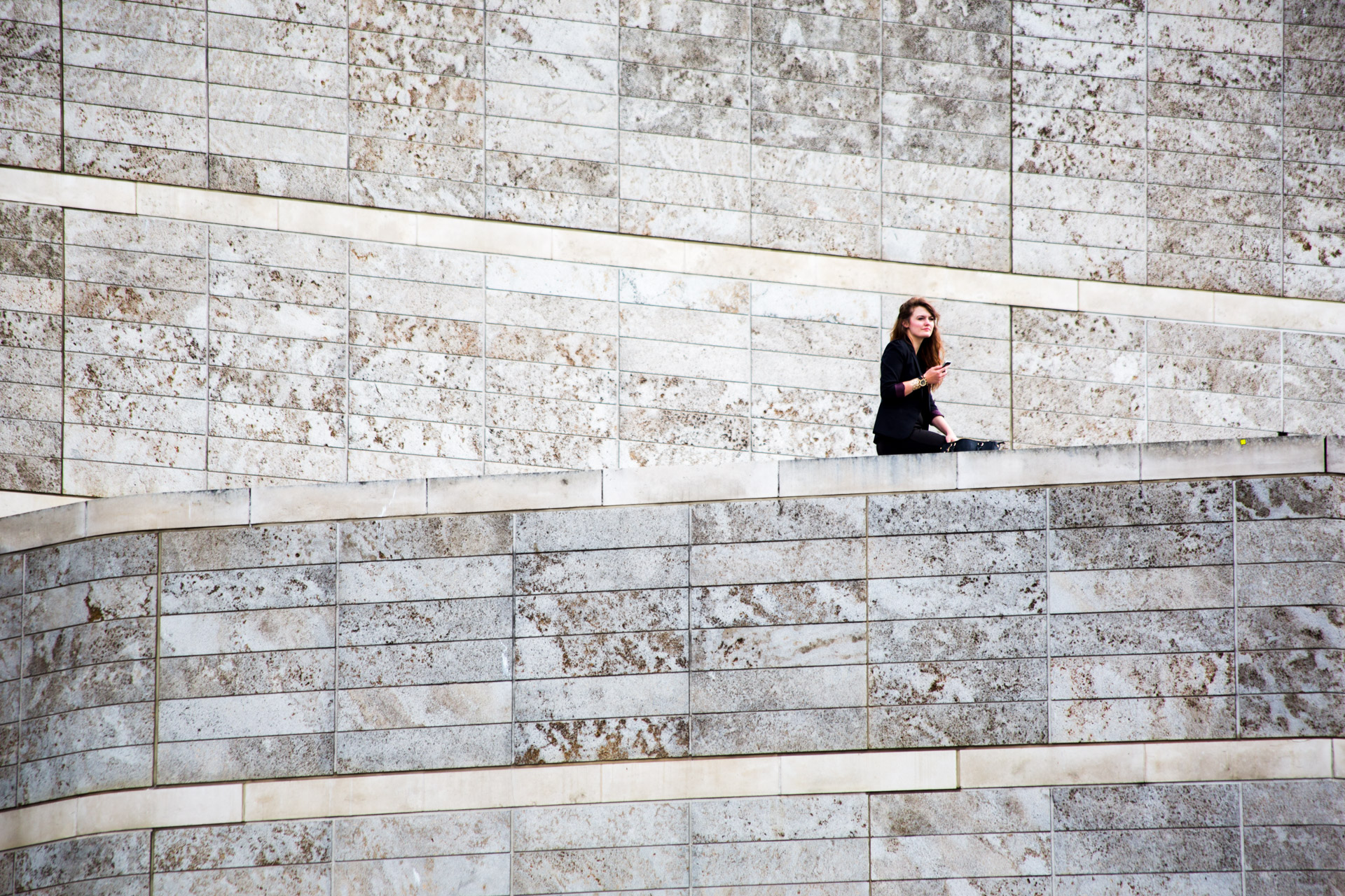 This girl was observing from high-up in the Liverpool ONE shopping centre on the final day of the Giant event. I really liked the starkness against the pattern and background of the walls.