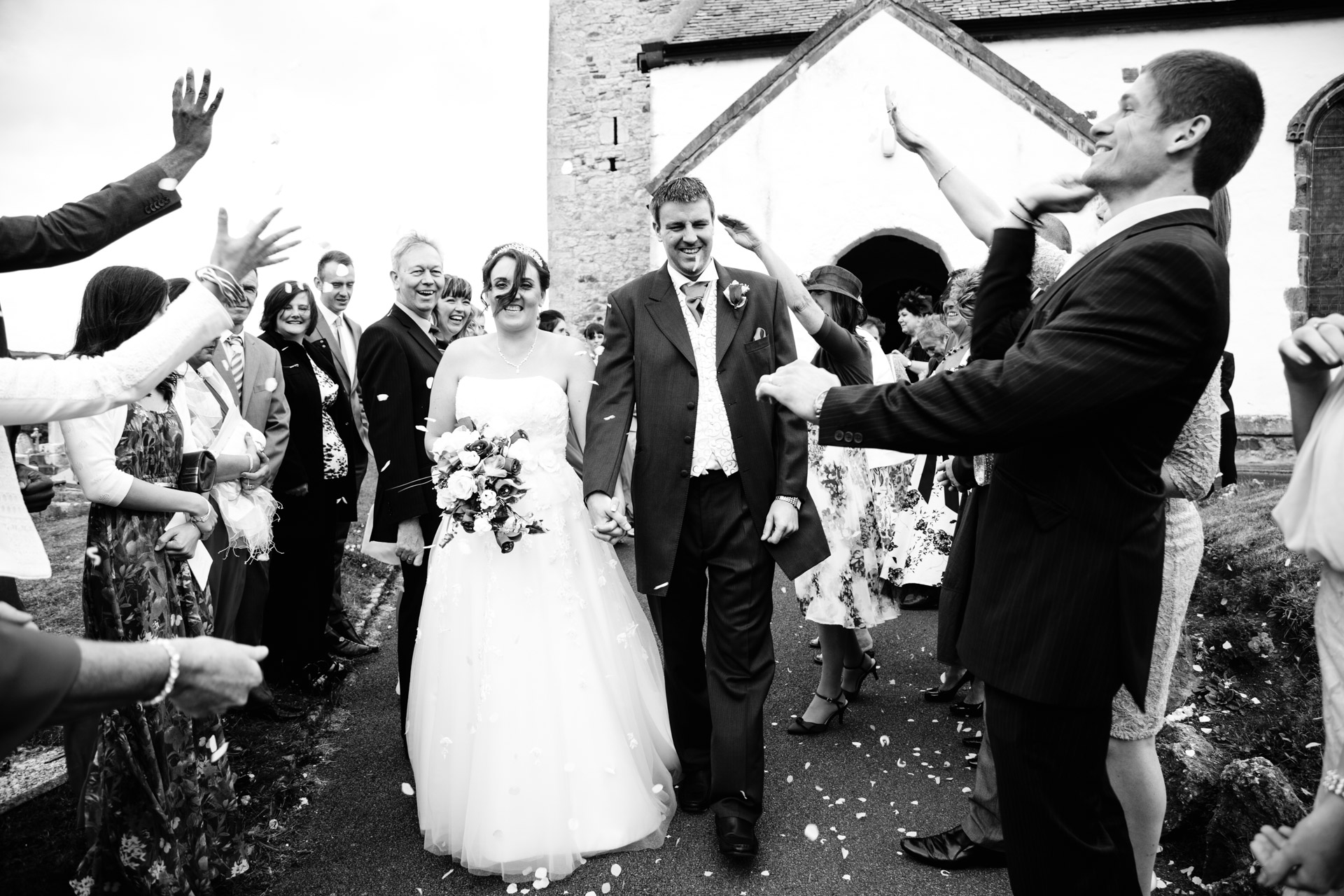 I shot my second wedding of the year in August for my friends Andrew and Nicola Leater. Andy has been a friend of mine for about 15 years so it was an honour. The group shot of all the guests outside this church was good photo too but I liked the action in this one.