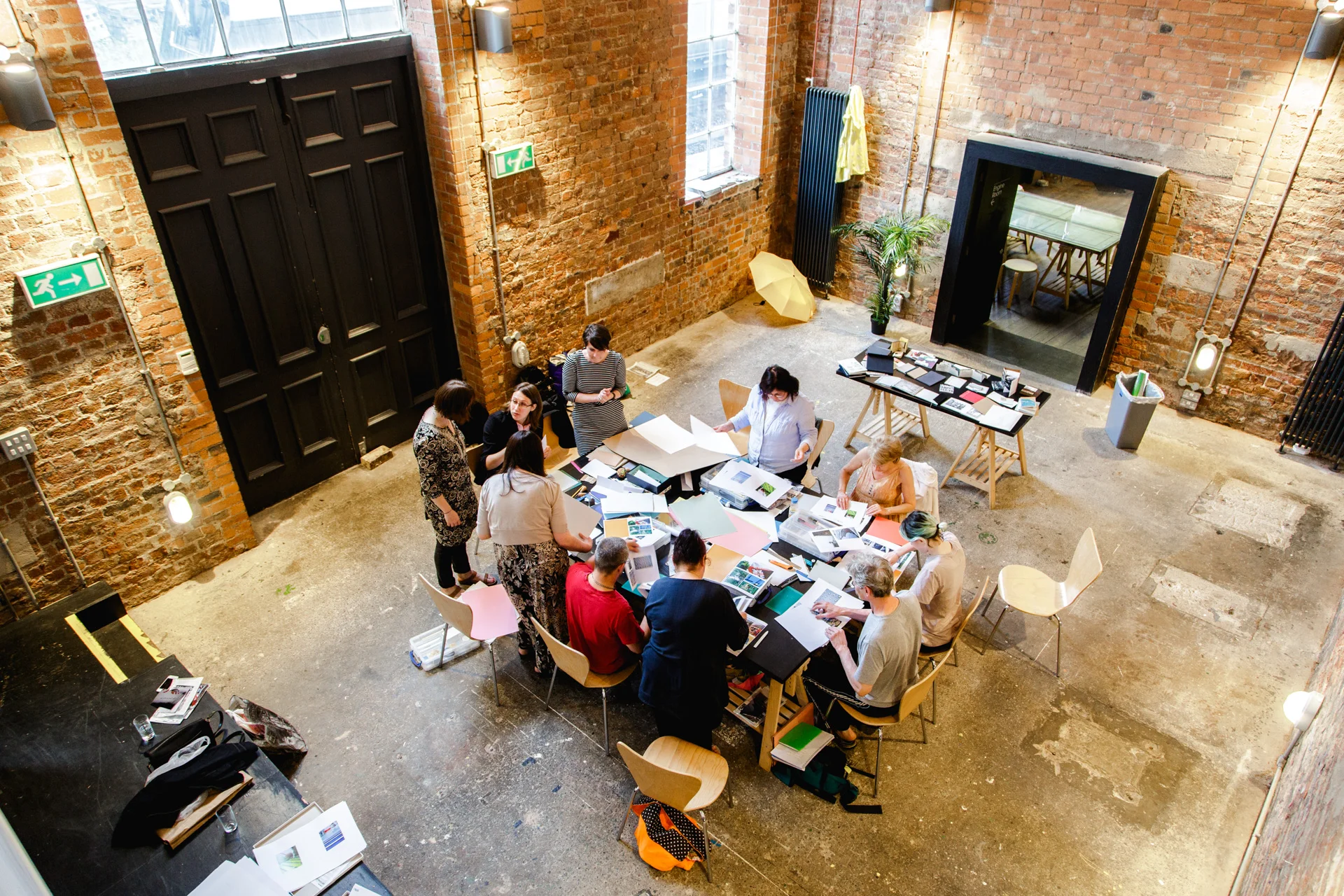 The group putting together the photobooks at Metal.