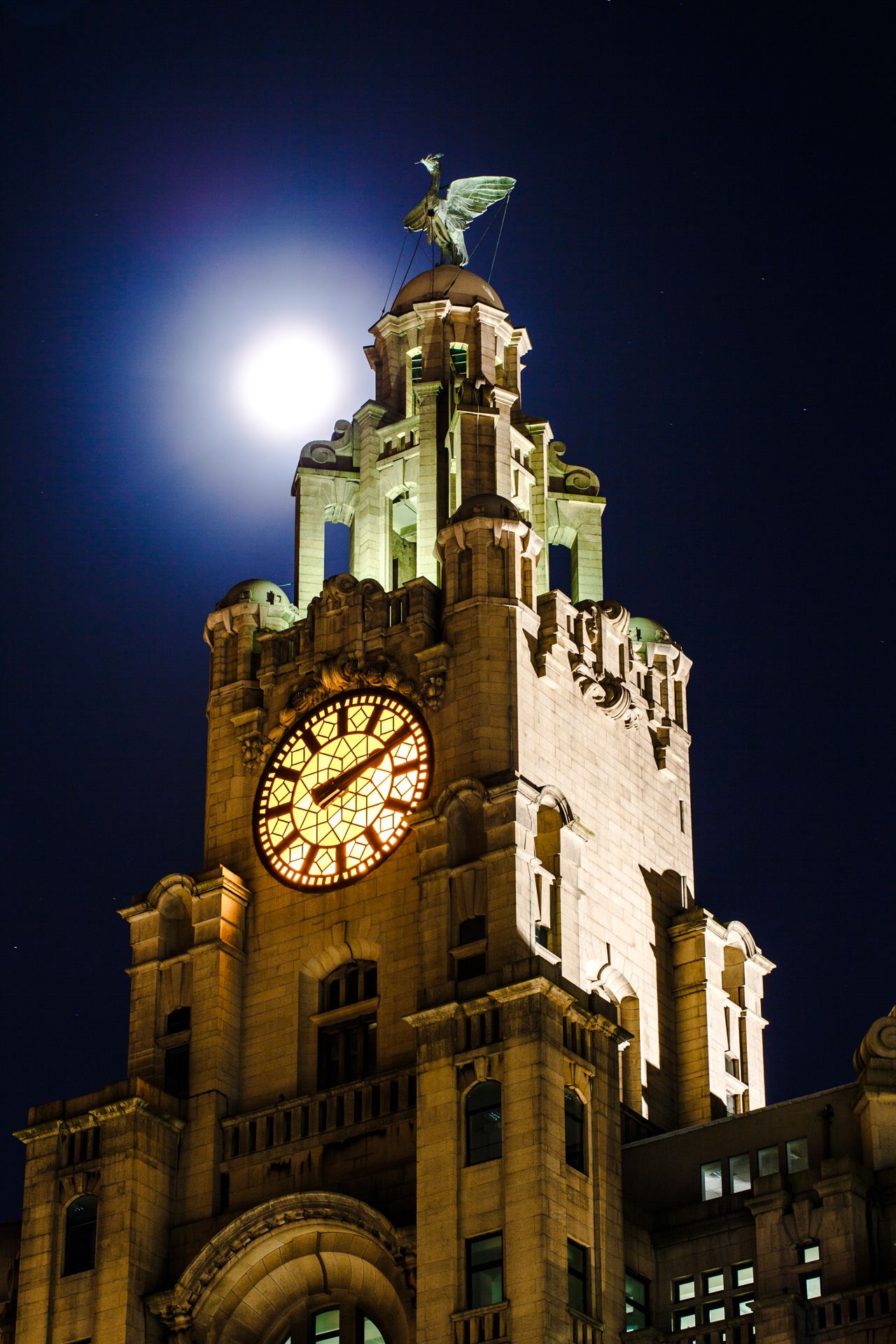 The Supermoon moving behind the Royal Liver Building