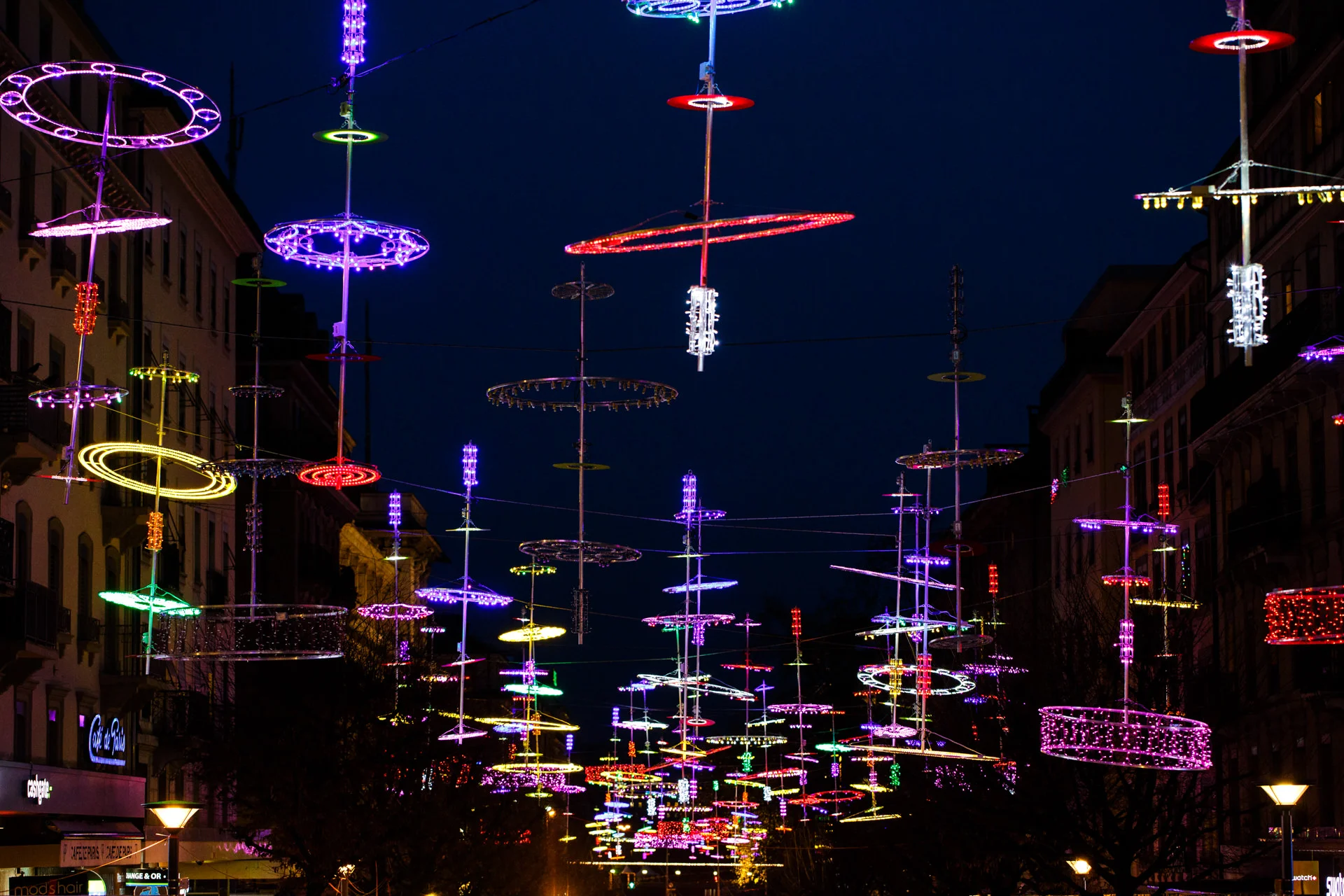 Christmas lights hanging above Rue du Mont-Blanc.