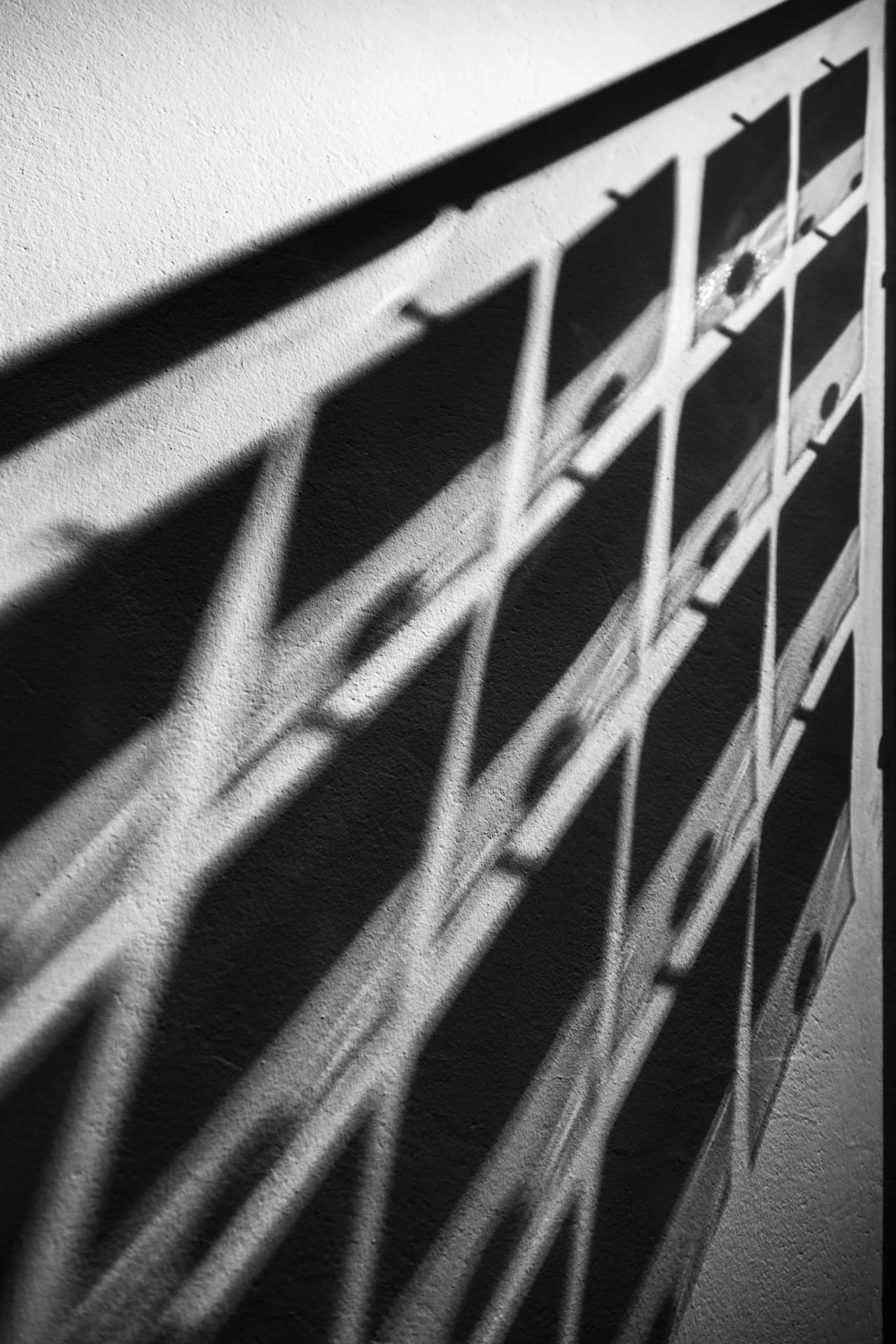 Shadows spill from a collection of old coins.