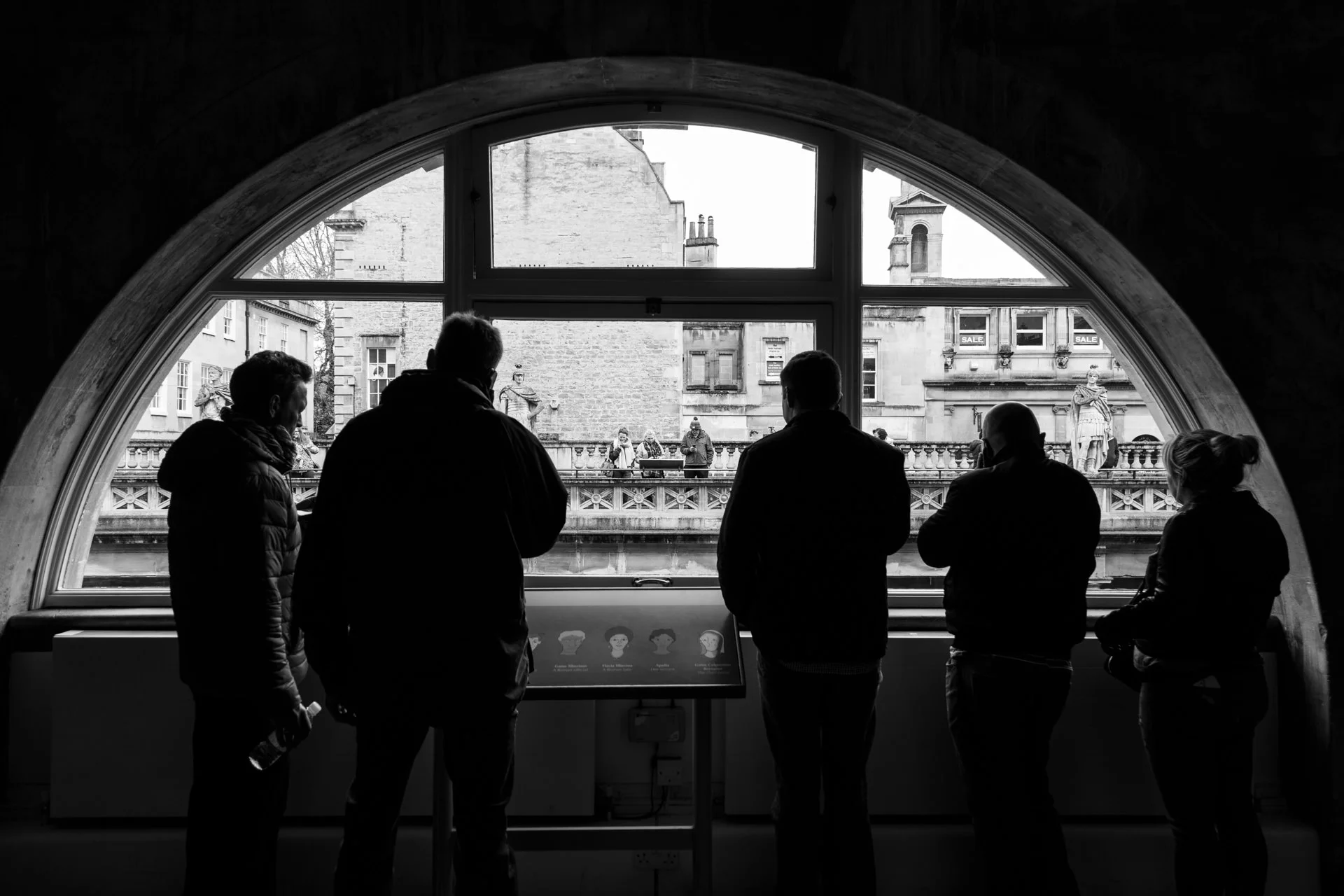 Visitors listening to audio guides.