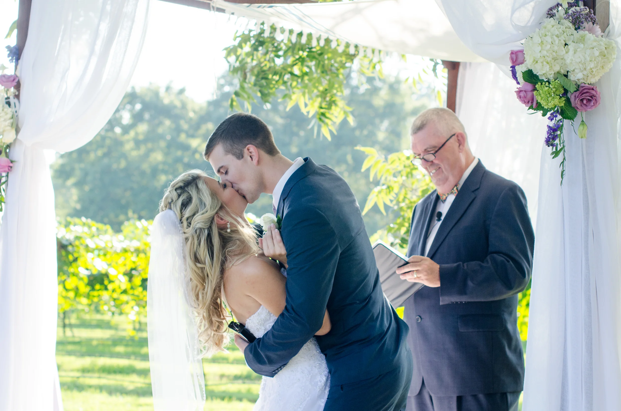 The couple had to wait a very long time for this first kiss, the officiant was teasing the couple a little bit to see how long they could hold out. Jeremy took full advantage of the moment when it finally happened!