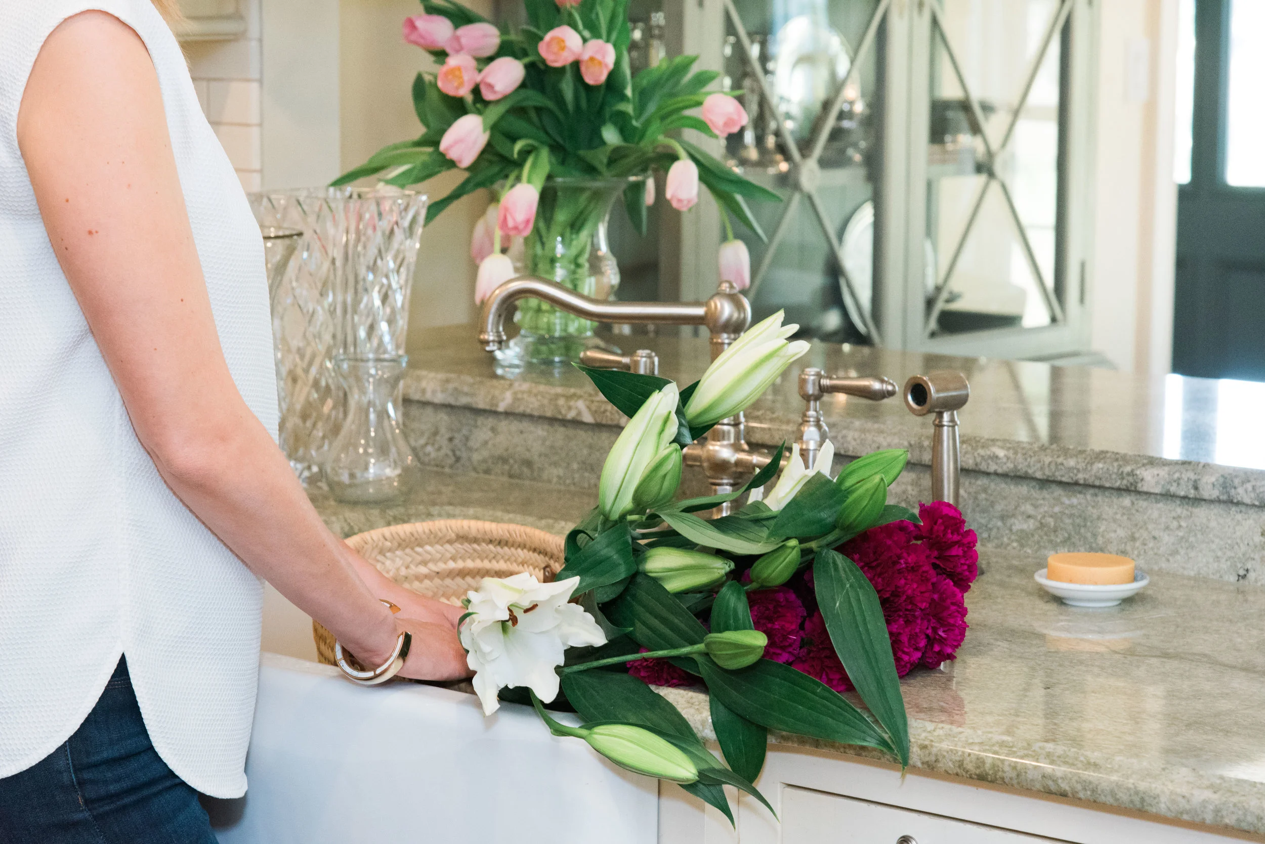 This house is all about understated elegance. To bring in color and texture, we opted for simple stems in fancy vases.