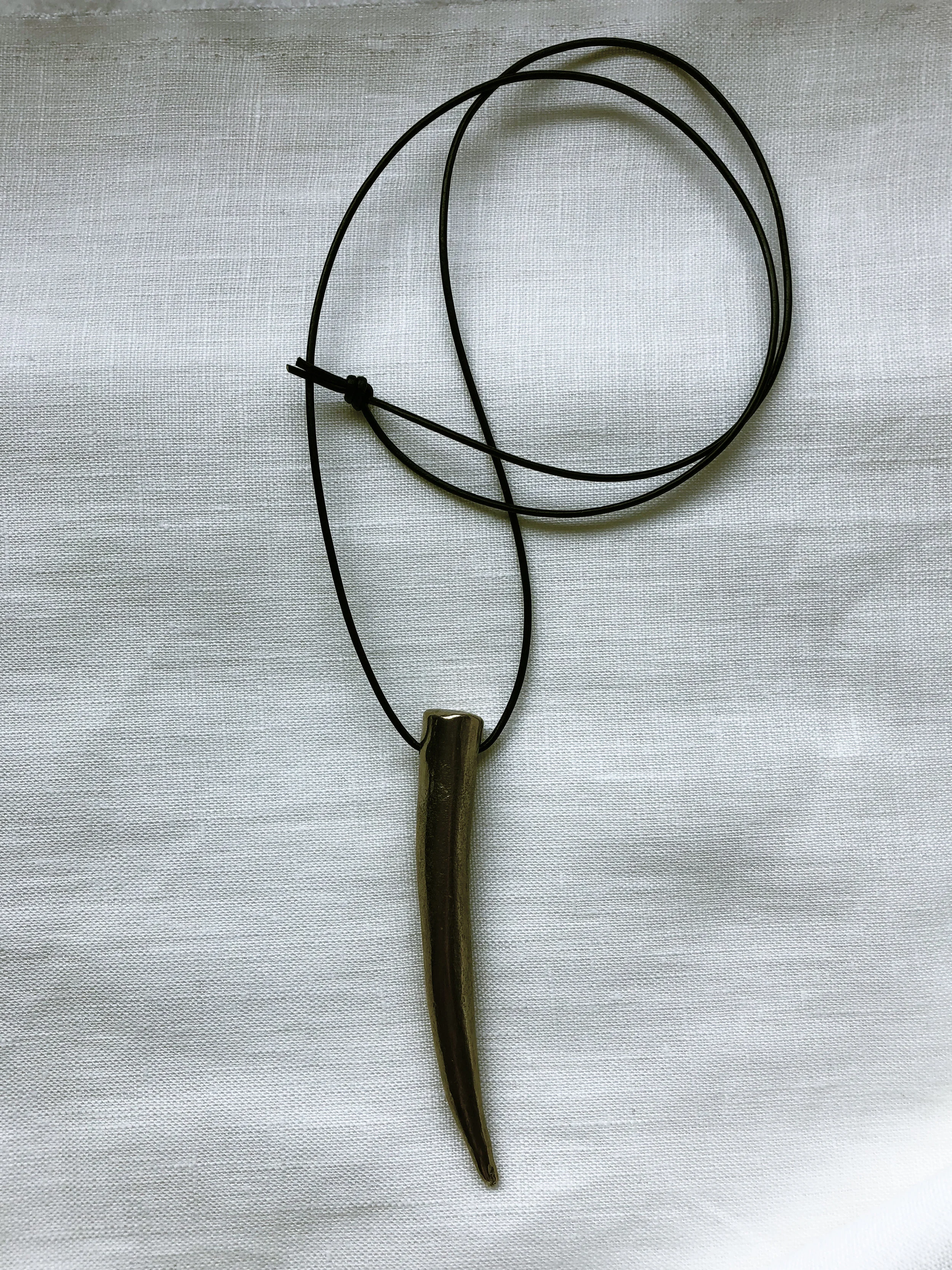 antler on linen with curled cord.jpg