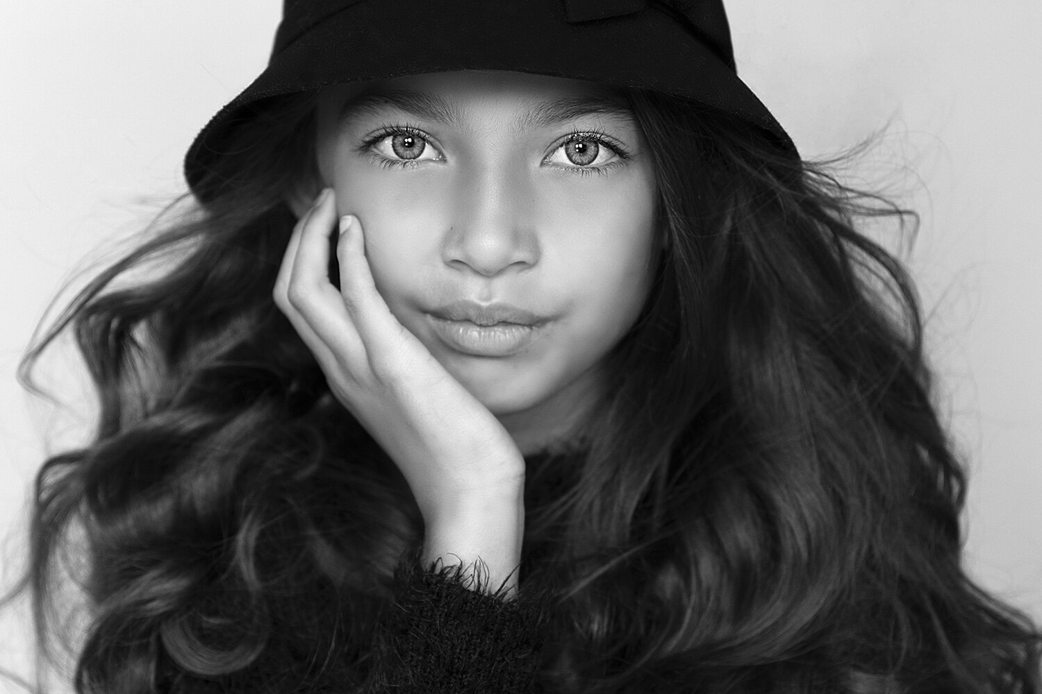 close up portrait young girl with green eyes and black hat.jpg