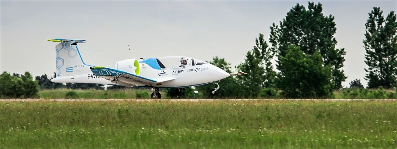 airbus-e-fan-taking-off-from-small-runway-surrounded-by-countryside.jpg
