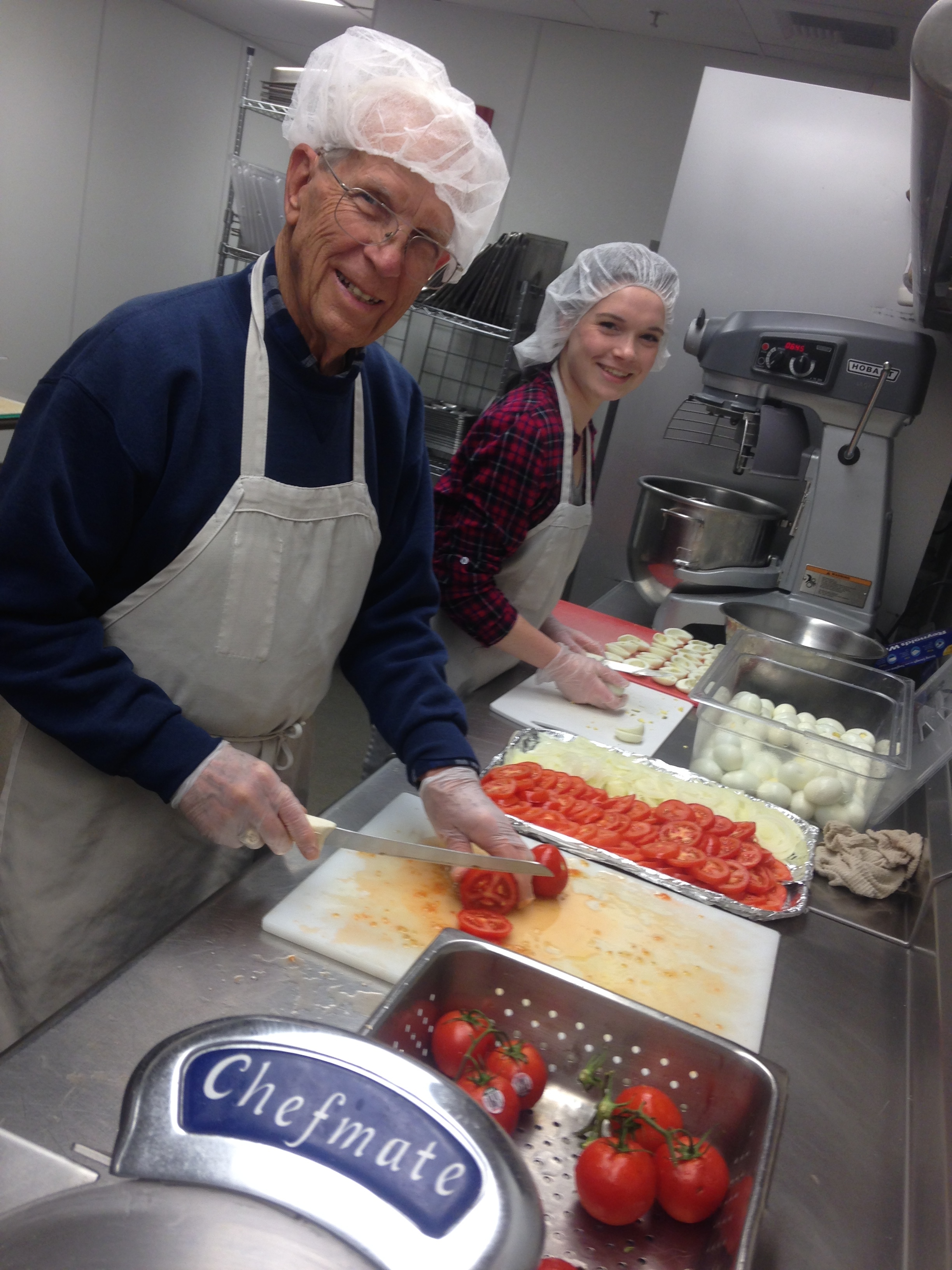 Faith in Action team members dish up smiles and great food at Tacoma Rescue Mission's Adams Street facility.