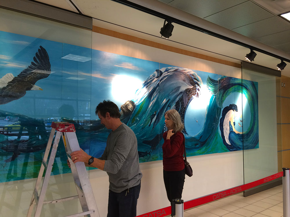 The glass wall is put back into position.