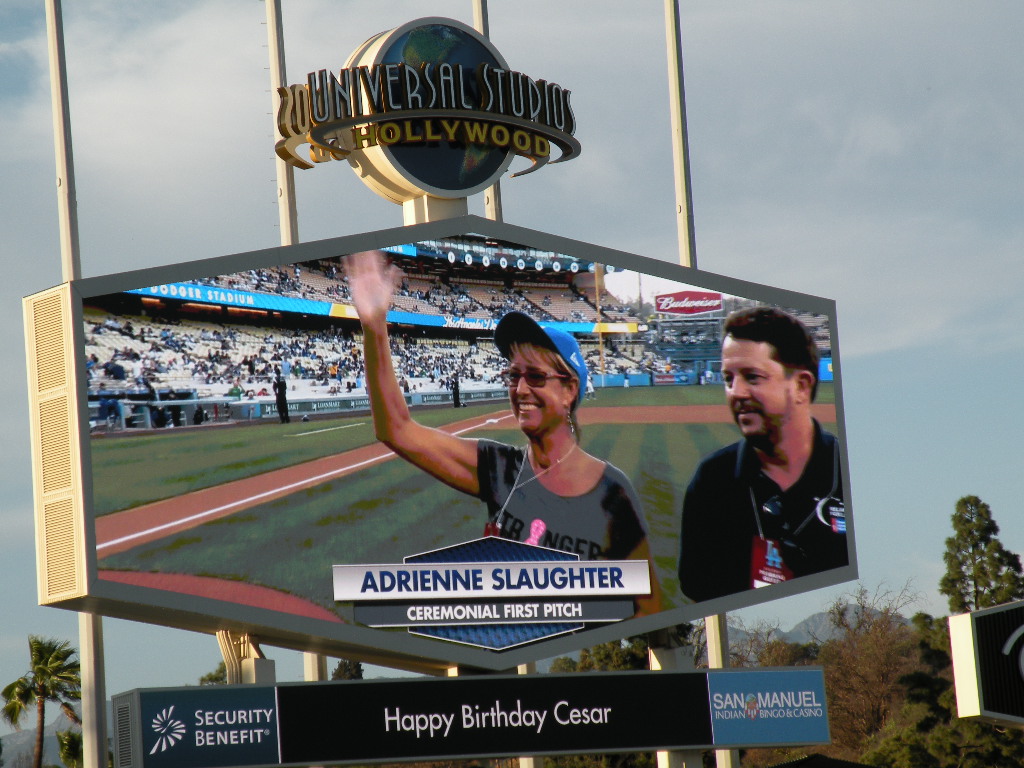 Adrienne Slaughter, seen on the Megatron, thanks the cheering fans after tossing the Ceremonial First Pitch at Dodgers' Stadium on May 1, 2015, as American Cancer Society's 2015 Hero and Voice of Hope.