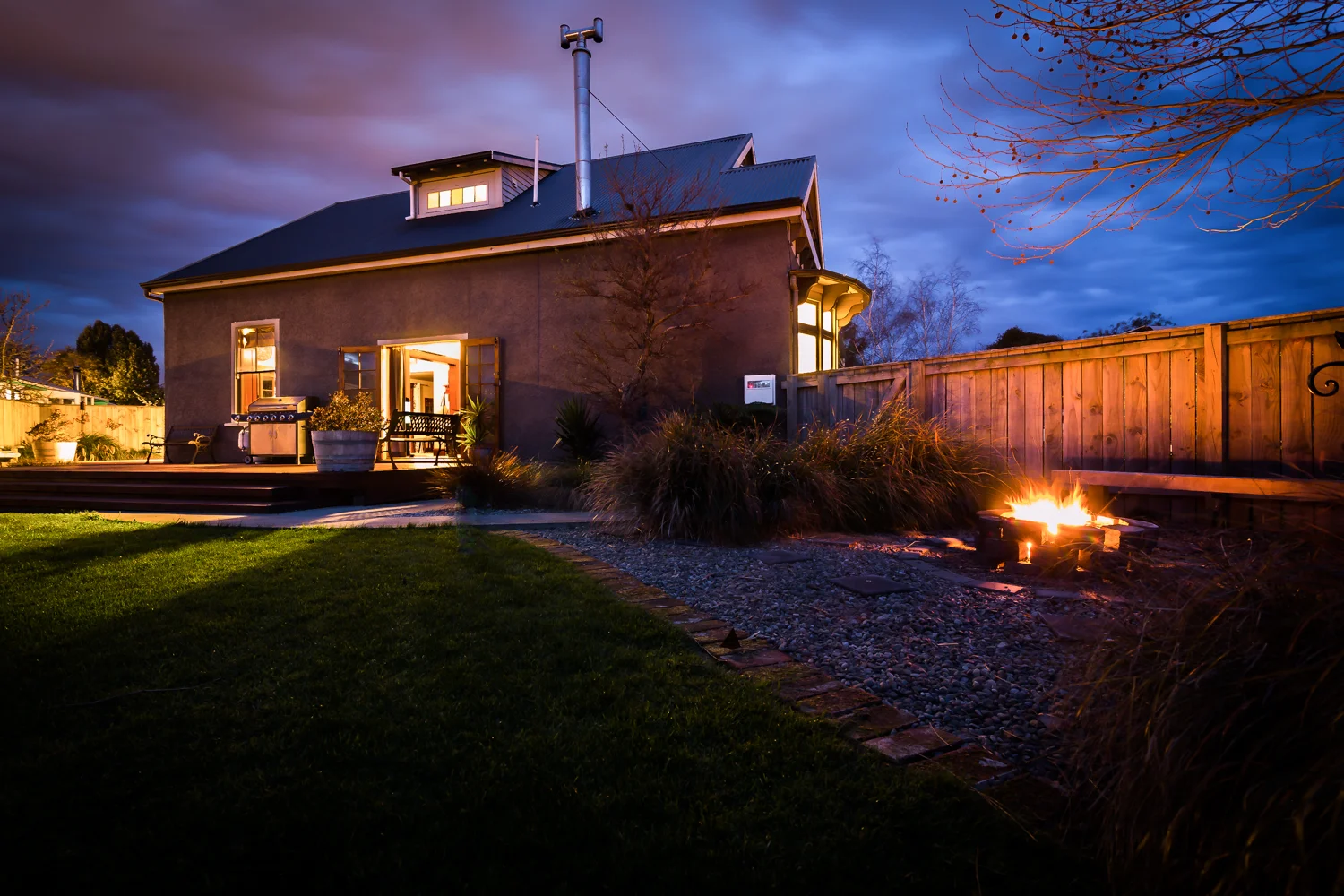 Twilight shot taken at the rear of the property.