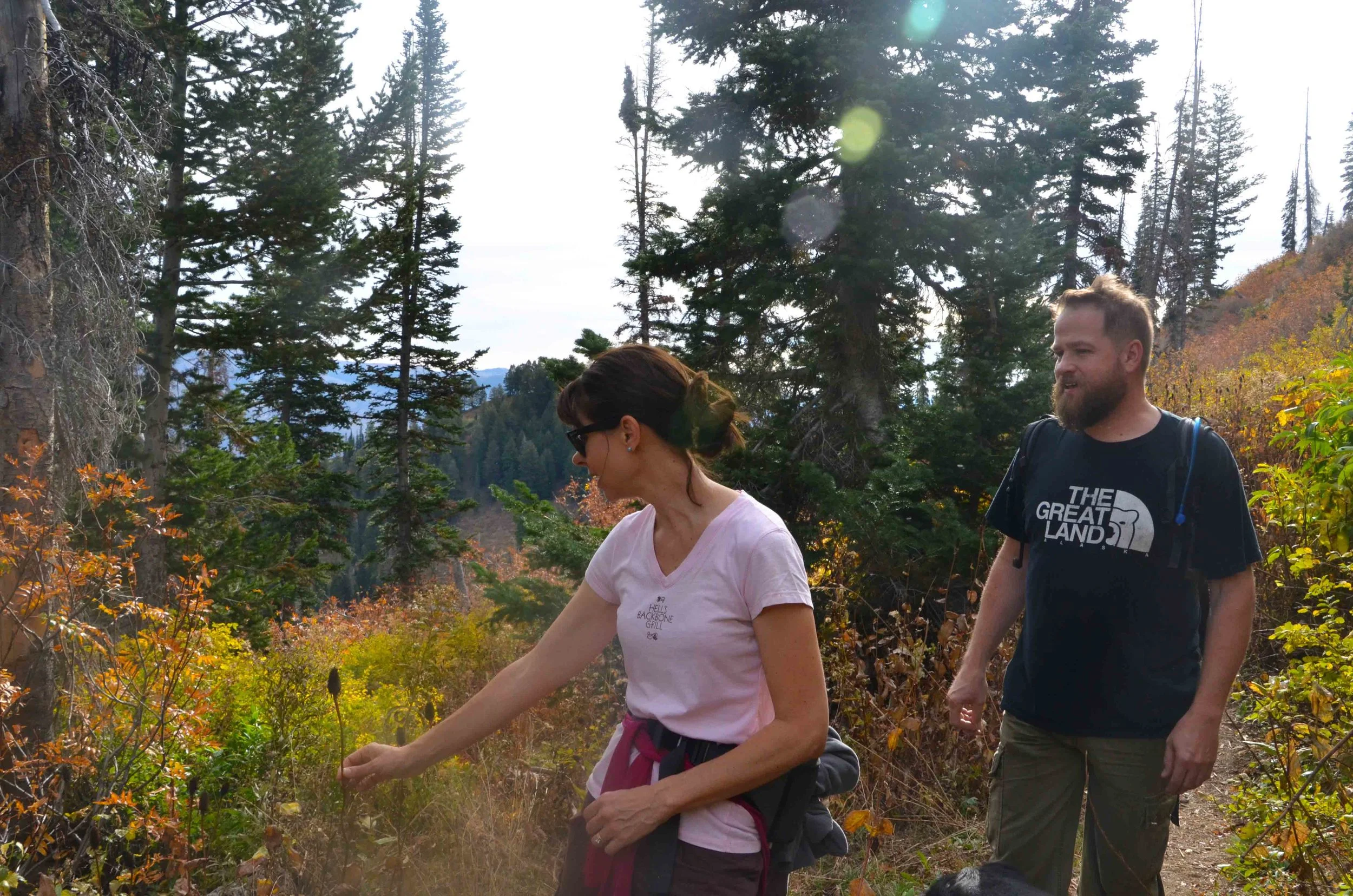 Brandi with the Ogden Nature Center explaining different types of flowers to Todd to the Top