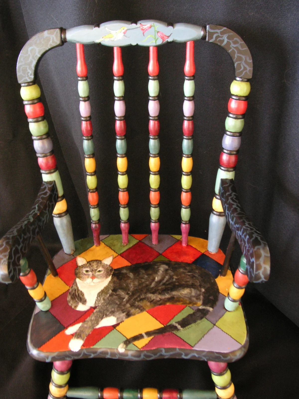 Child's rocker with cat